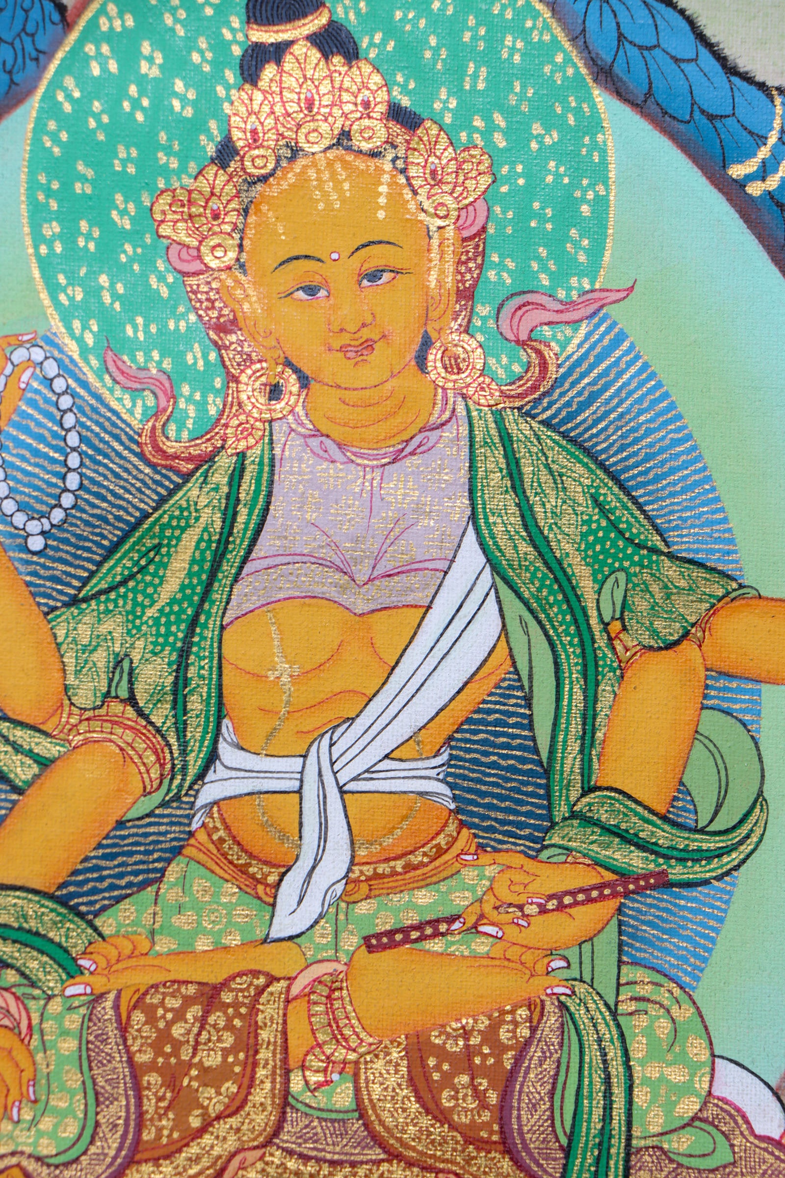 This 21 Tara Thangka is a genuine hand-painted masterpiece that honors the 21 forms of Tara, the compassionate female Bodhisattva known for protection and swift assistance. Rich in spiritual symbolism and crafted with traditional pigments, it serves as a powerful aid for meditation, mantra recitation, and deep devotional practice.