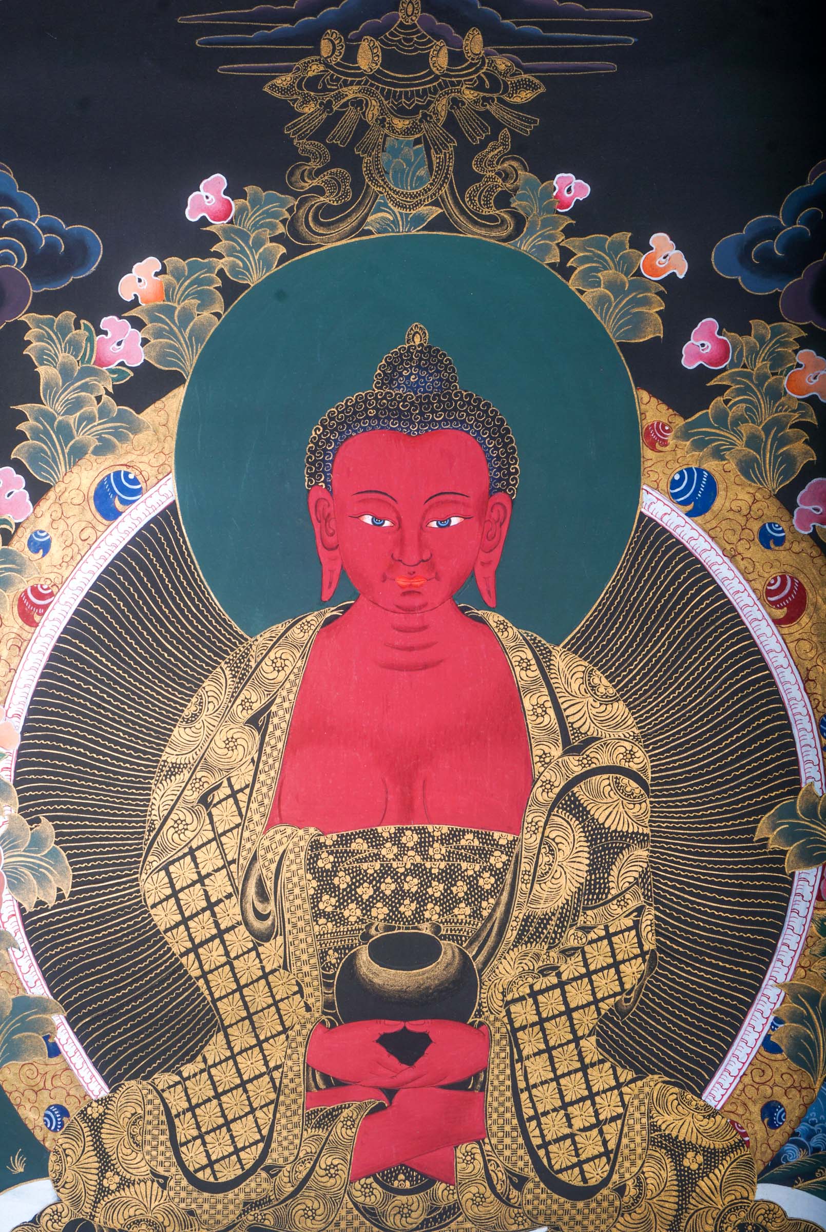 This genuine Tibetan Thangka of Amitabha Buddha beautifully captures his essence as the Buddha of Infinite Light and Life, central to Pure Land Buddhism. Hand-painted with mineral pigments, it brings peace, compassion, and enlightenment into any sacred space.