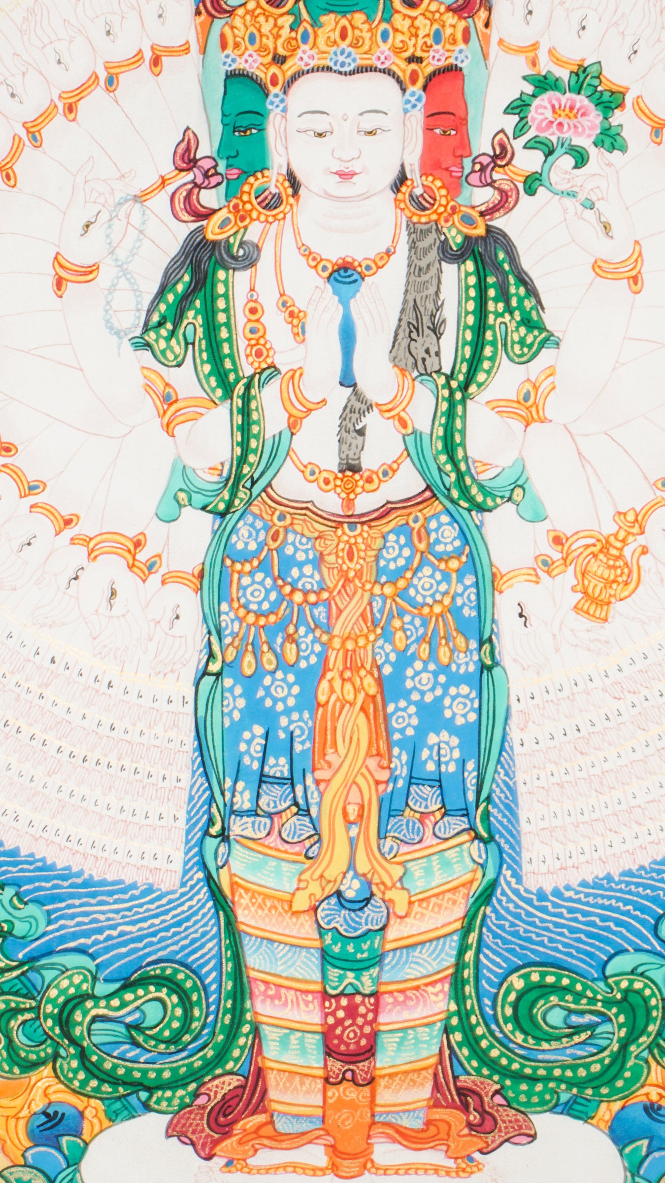 Tibetan Thangka painting of Avalokiteshvara, painted with mineral pigments on cotton. The artwork shows the Buddha of Compassion with multiple arms, holding symbolic objects.