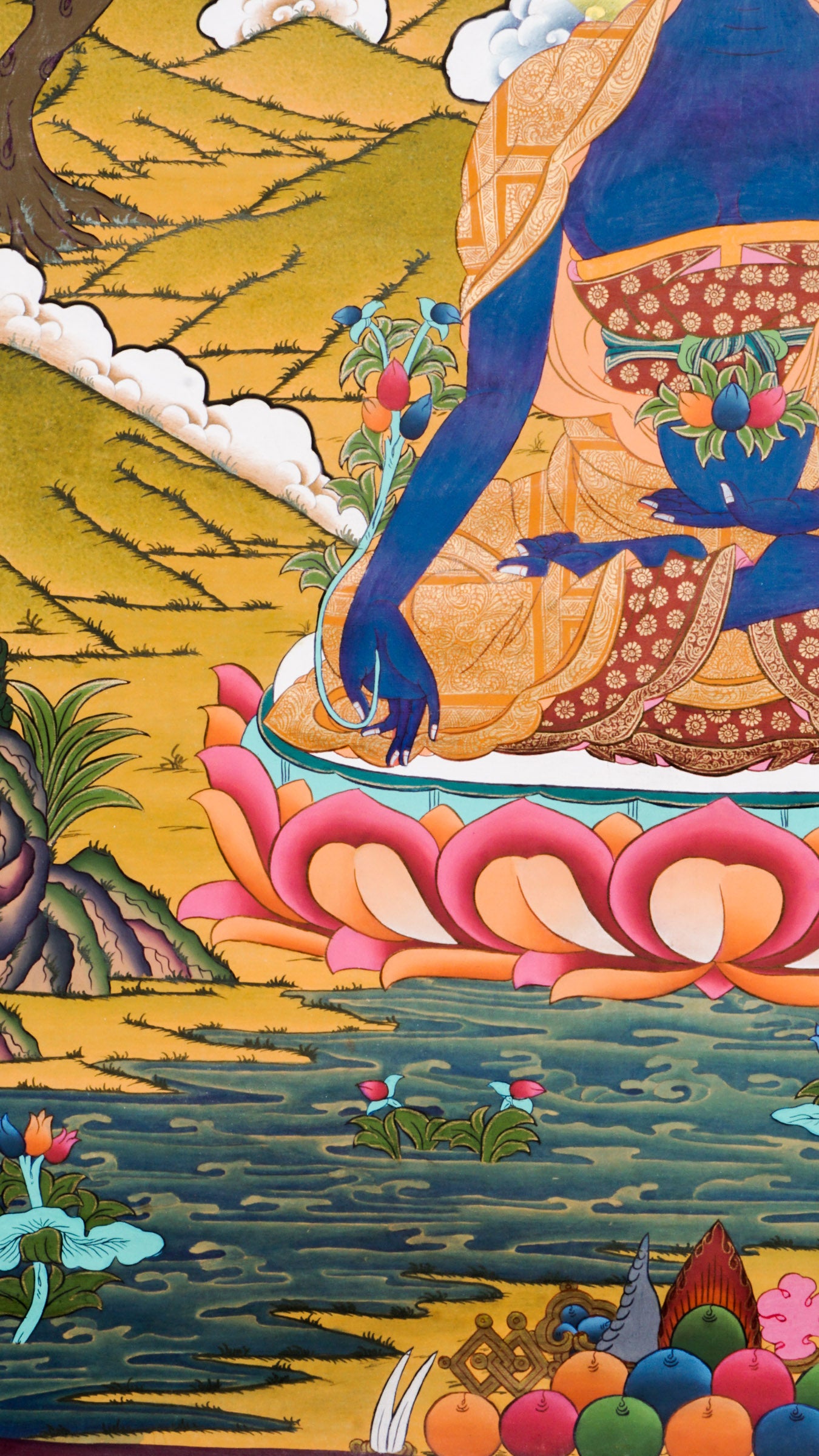 Medicine Buddha Thangka is a genuine Tibetan Buddhist painting that represents healing, balance, and spiritual protection. Painted in deep lapis blue, the Medicine Buddha holds the arura plant and a nectar bowl, symbolizing the power to heal illness and purify negative energy.