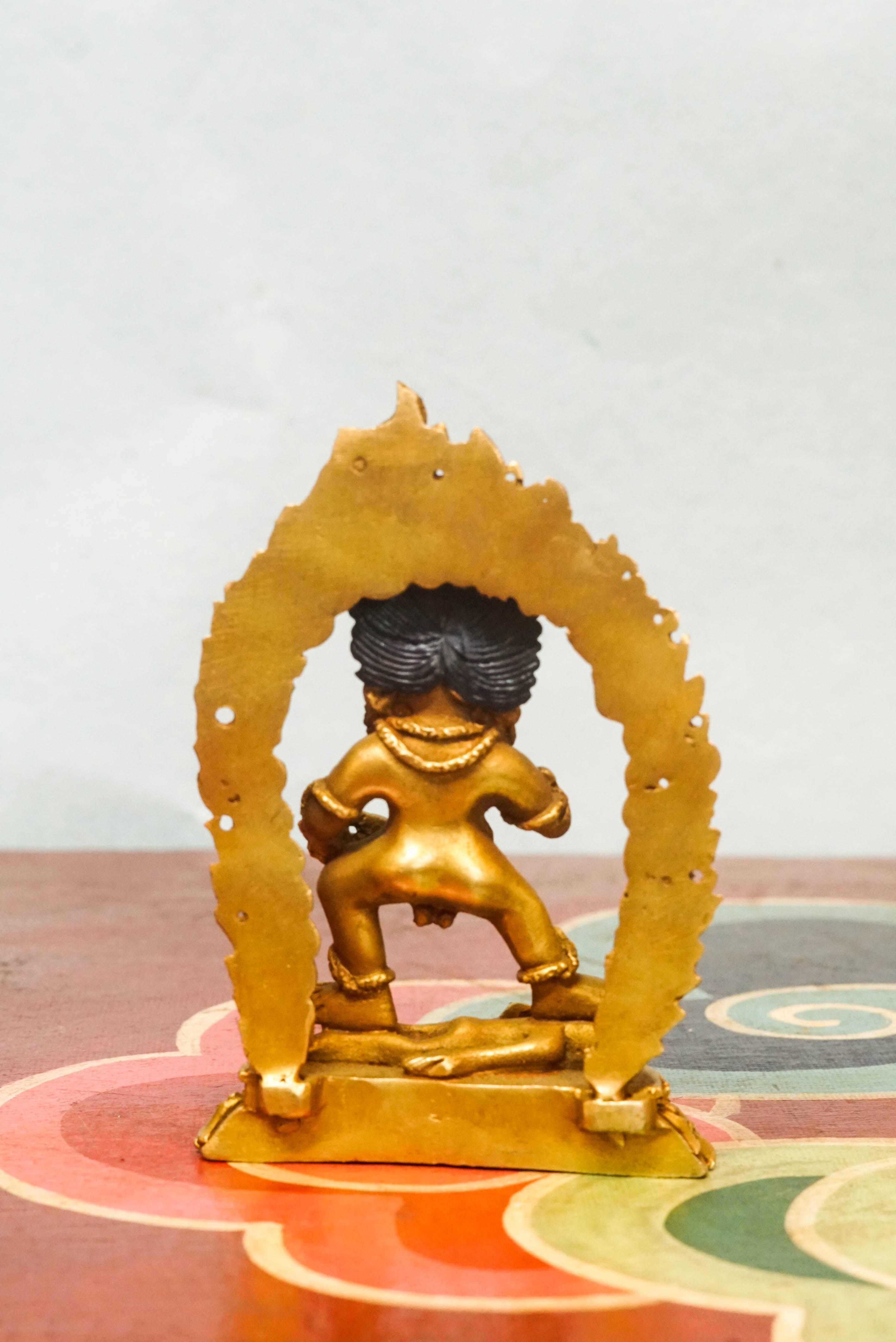 Fierce Black Zambala statue seated on a lotus or snow lion, symbolizing wealth, protection, and the destruction of obstacles.