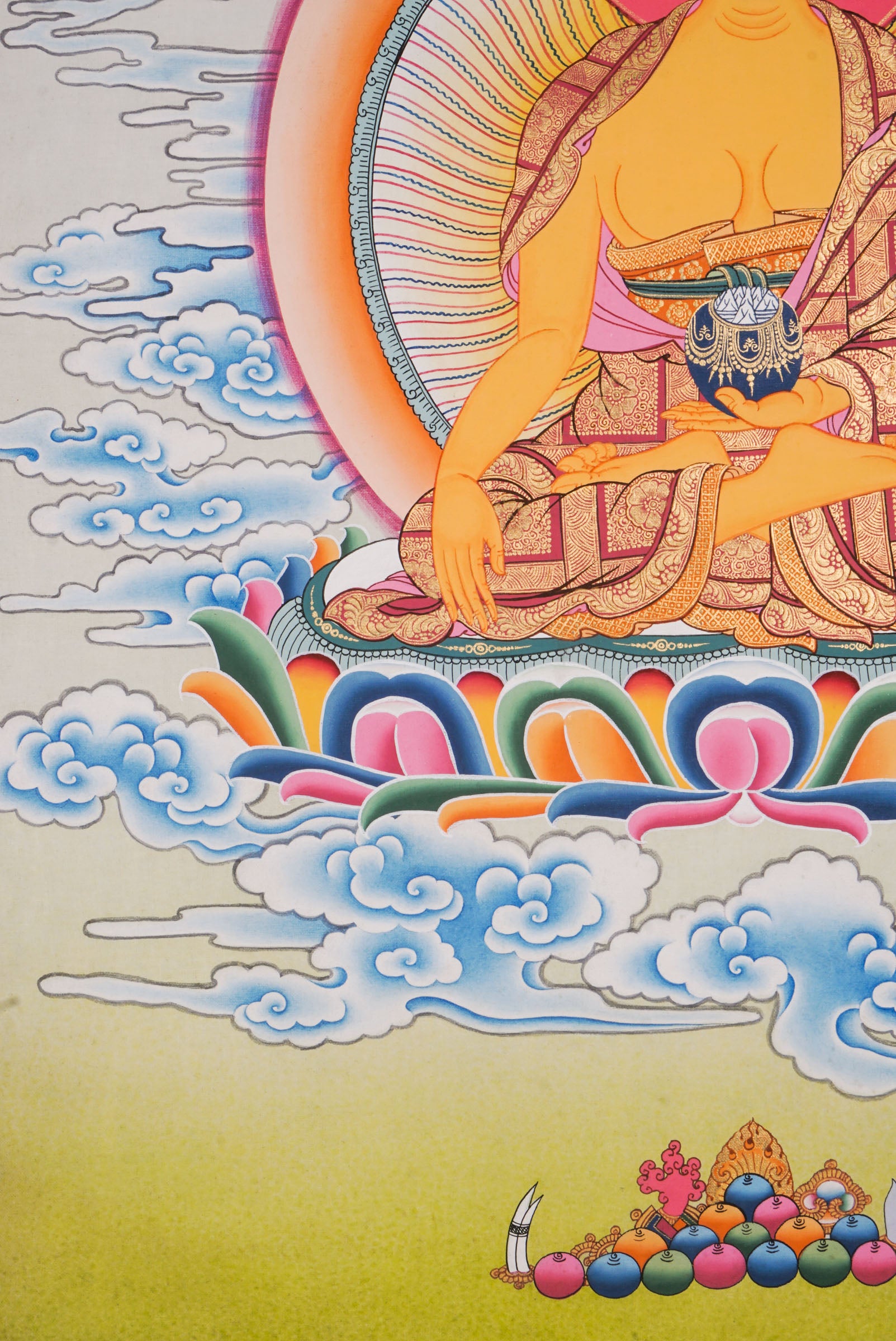 Using traditional techniques this hand-painted Shakyamuni Buddha Thangka is created by skilled Nepali artisans using 24k gold and natural pigments.