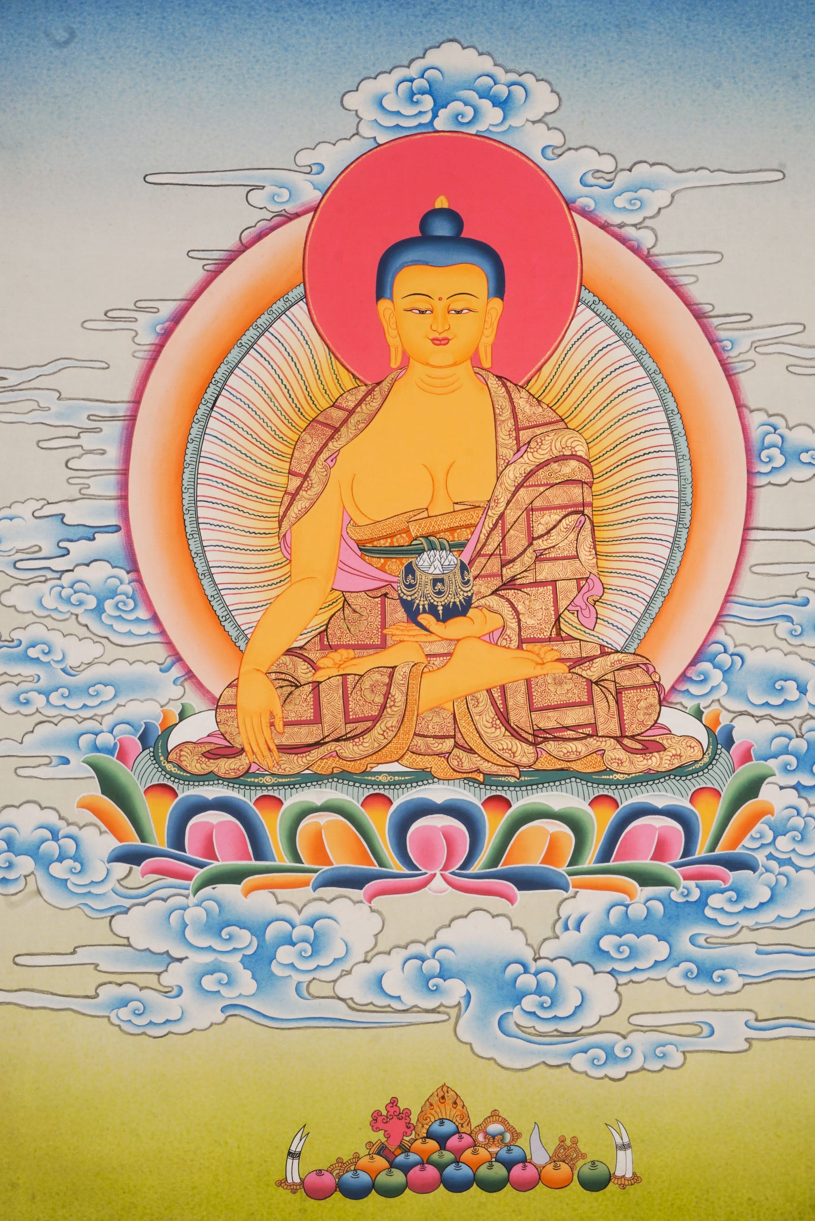 Using traditional techniques this hand-painted Shakyamuni Buddha Thangka is created by skilled Nepali artisans using 24k gold and natural pigments.