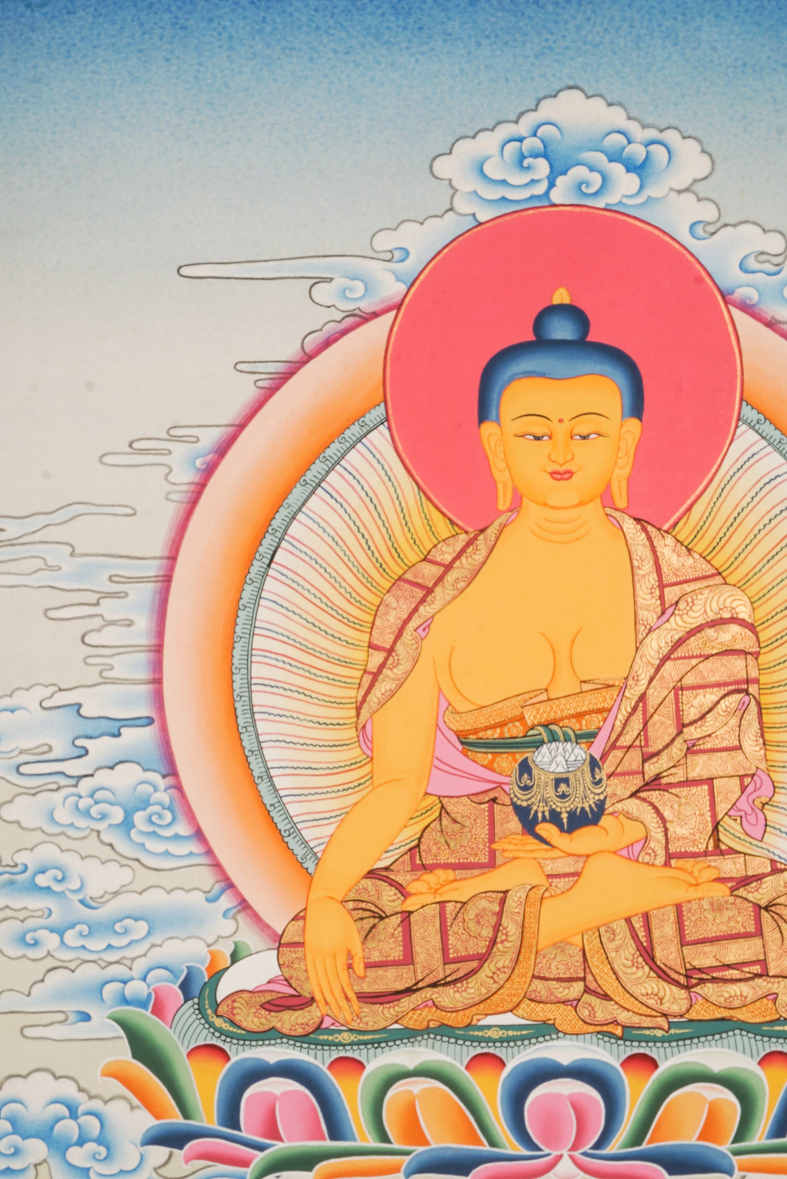 Using traditional techniques this hand-painted Shakyamuni Buddha Thangka is created by skilled Nepali artisans using 24k gold and natural pigments.