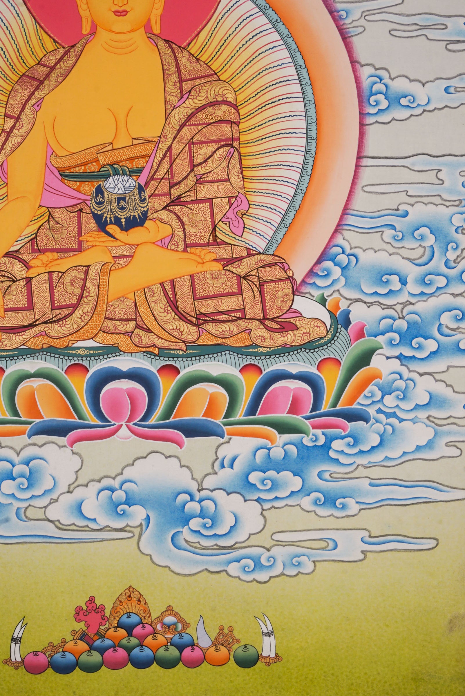 Using traditional techniques this hand-painted Shakyamuni Buddha Thangka is created by skilled Nepali artisans using 24k gold and natural pigments.