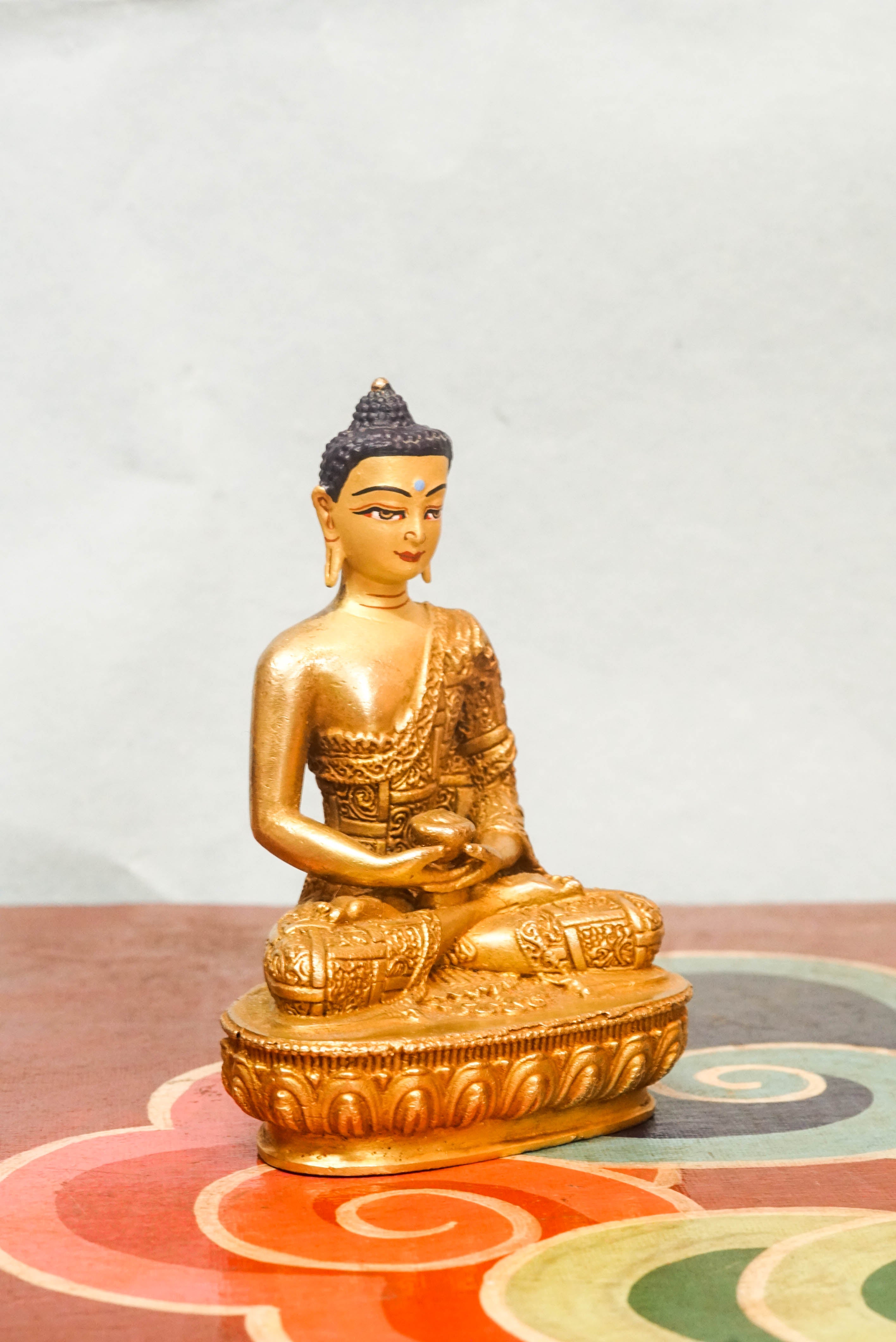 Buddha seated in meditation, reflecting the Dharma and principles of compassion, wisdom, and awakening.