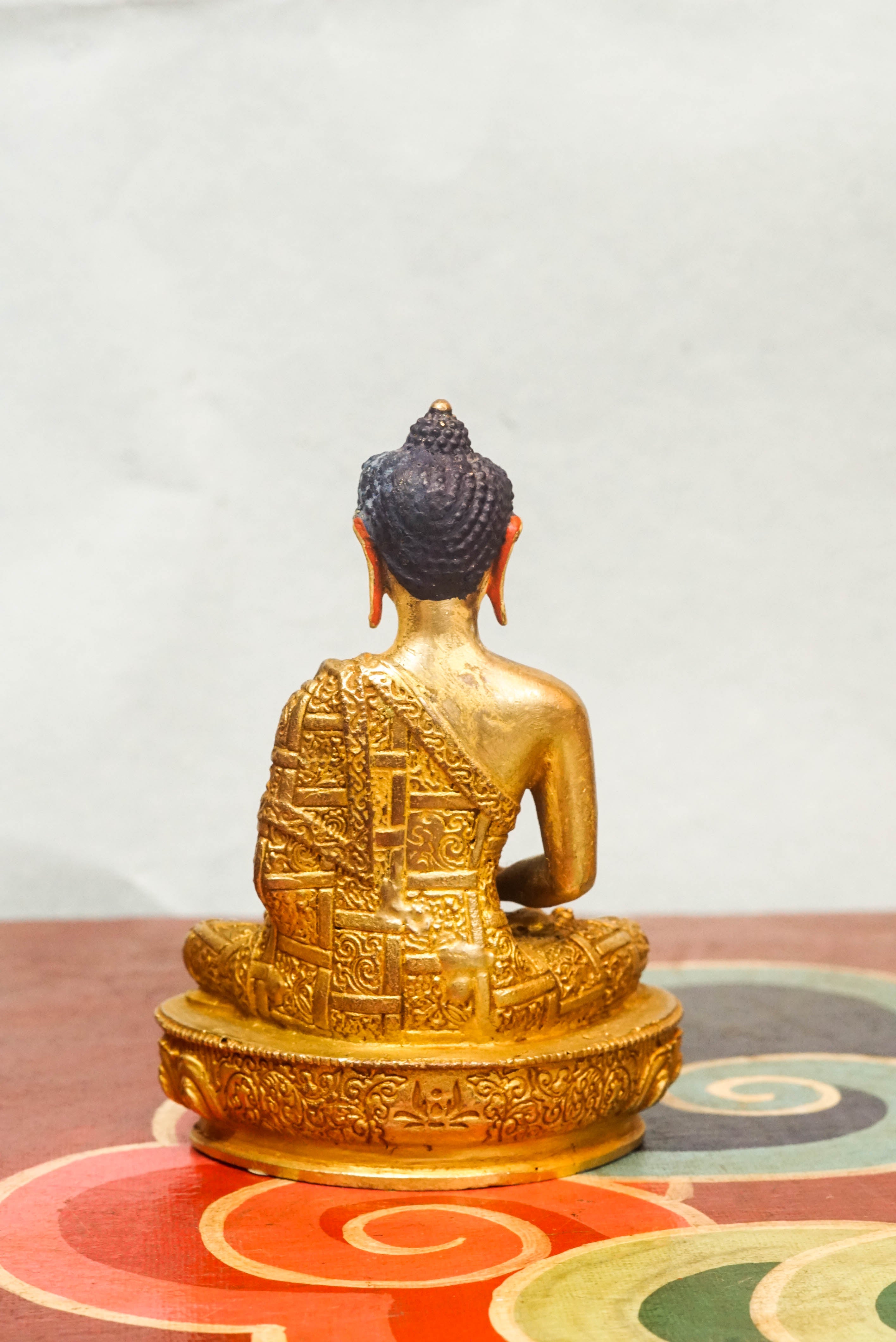 Buddha seated in meditation, reflecting the Dharma and principles of compassion, wisdom, and awakening.