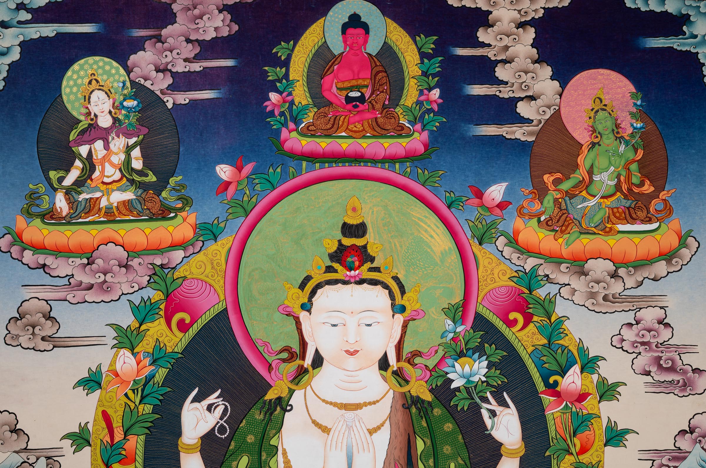 This Chenrezig Thangka - a hand-painted artwork with Green Tara, white Tara and Amitabha buddha at the Top
