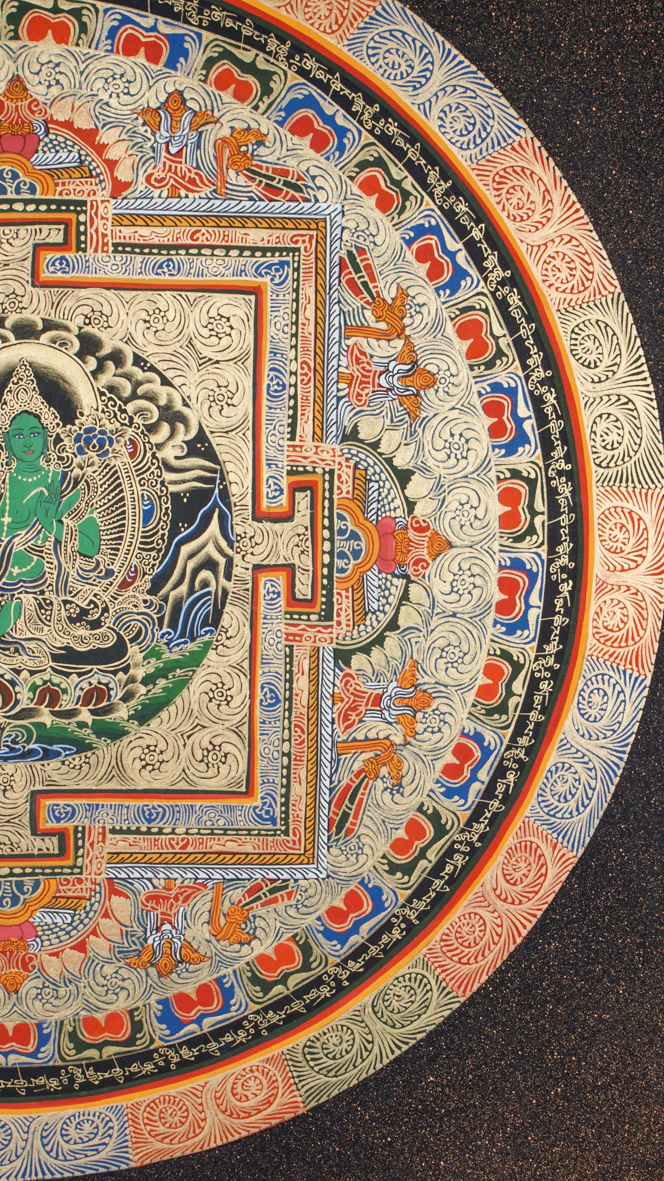 A circular mandala showcasing Green Tara at the center, hand painted in Nepal by skilled artisans.