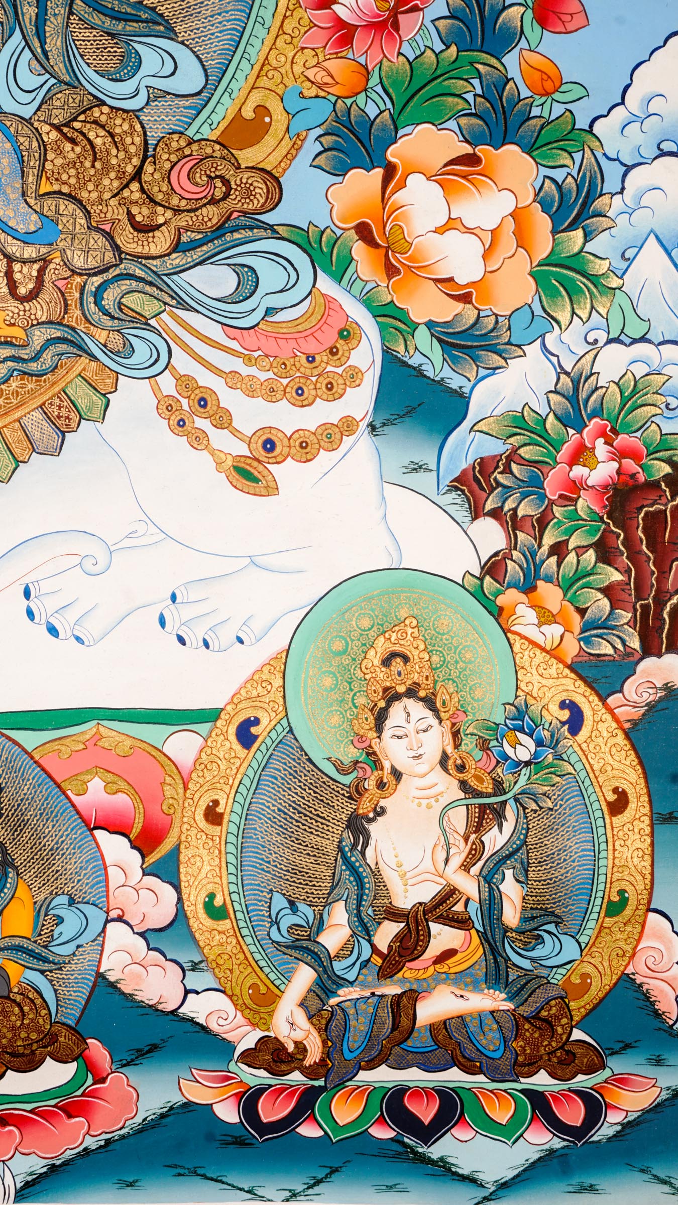 Tibetan thangka of Tara on a white elephant holding a lotus and blessing mudra, surrounded by celestial beings, clouds, and floral patterns.