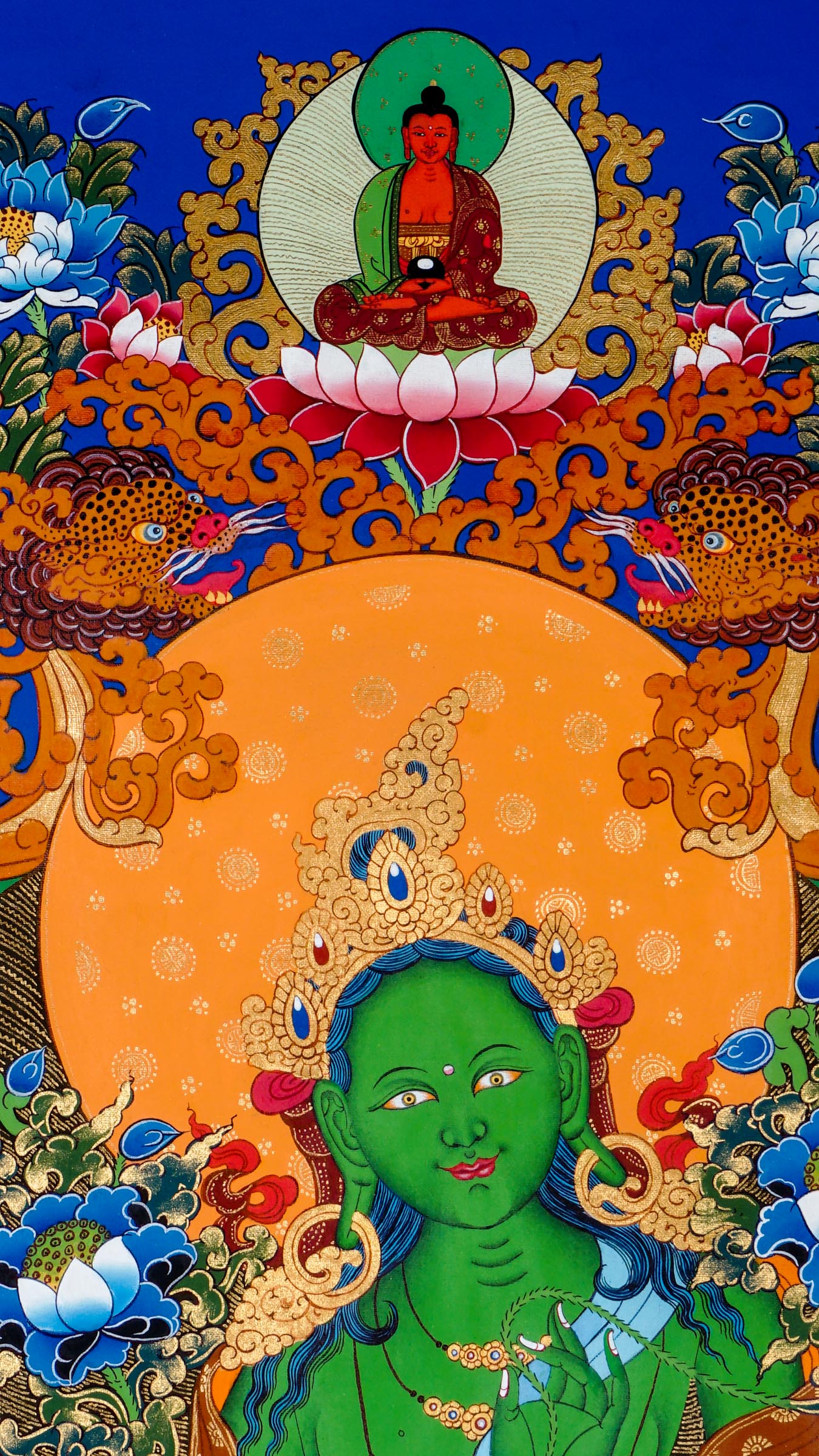 Tibetan thangka of Green Tara in green form seated in lalitasana on a golden lotus throne, right hand in varada mudra, left hand holding a blue lotus, surrounded by flowers and divine light.