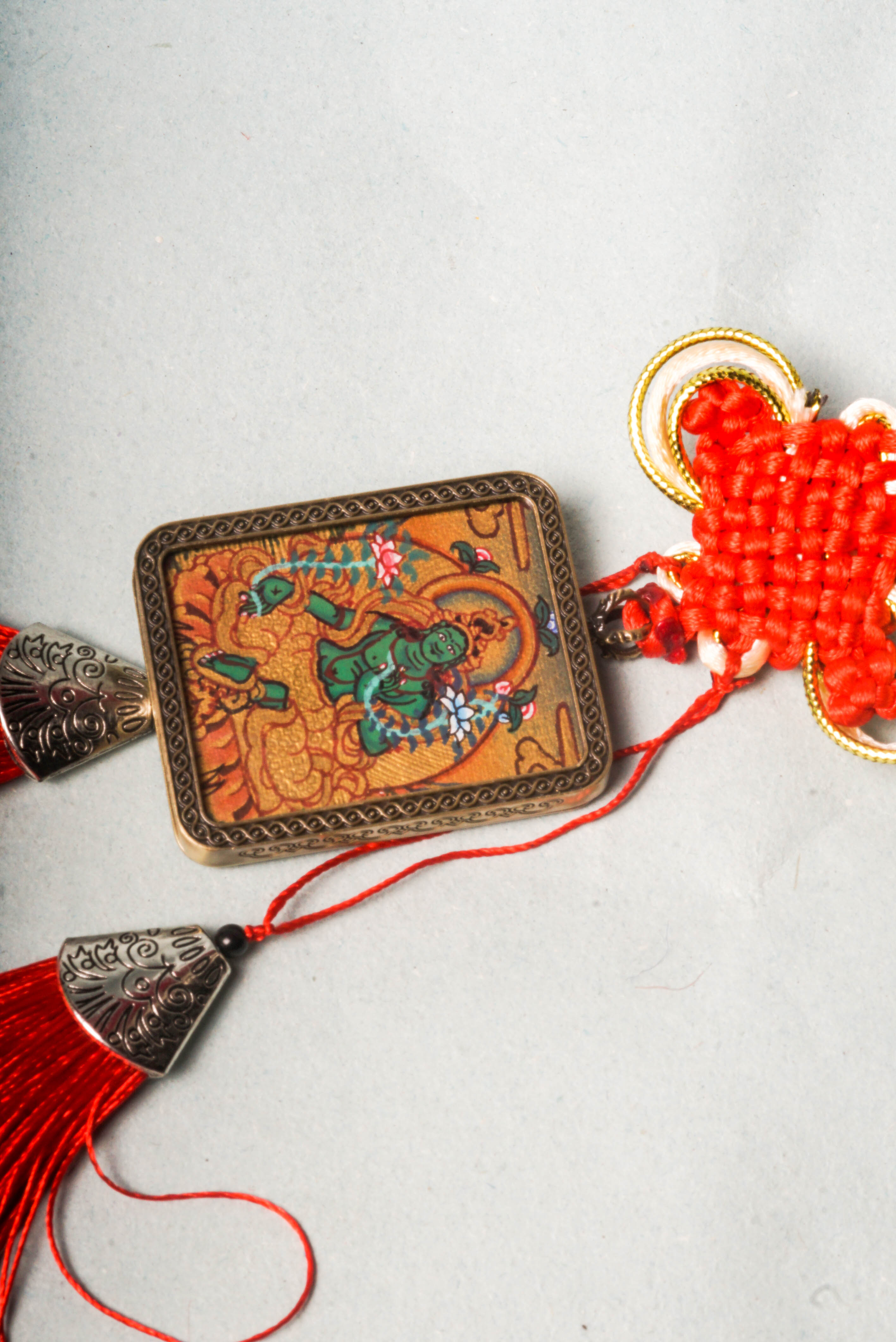 The Green Tara Ghau Thangka is a hand-painted sacred artwork symbolizing compassion, protection, and swift healing. Featuring her vibrant green form and crafted with natural pigments, it serves as a portable shrine to invite Tara’s blessings and grace into your space.