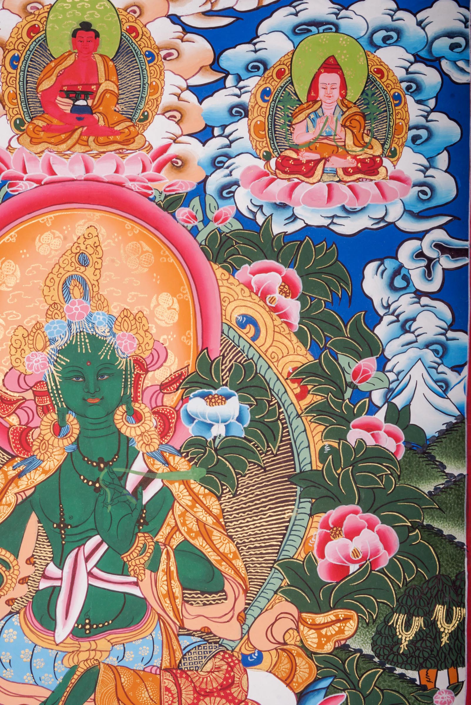 This genuine Tibetan Green Tara Thangka showcases the goddess of compassion and protection, hand-painted with natural pigments in traditional Himalayan style.