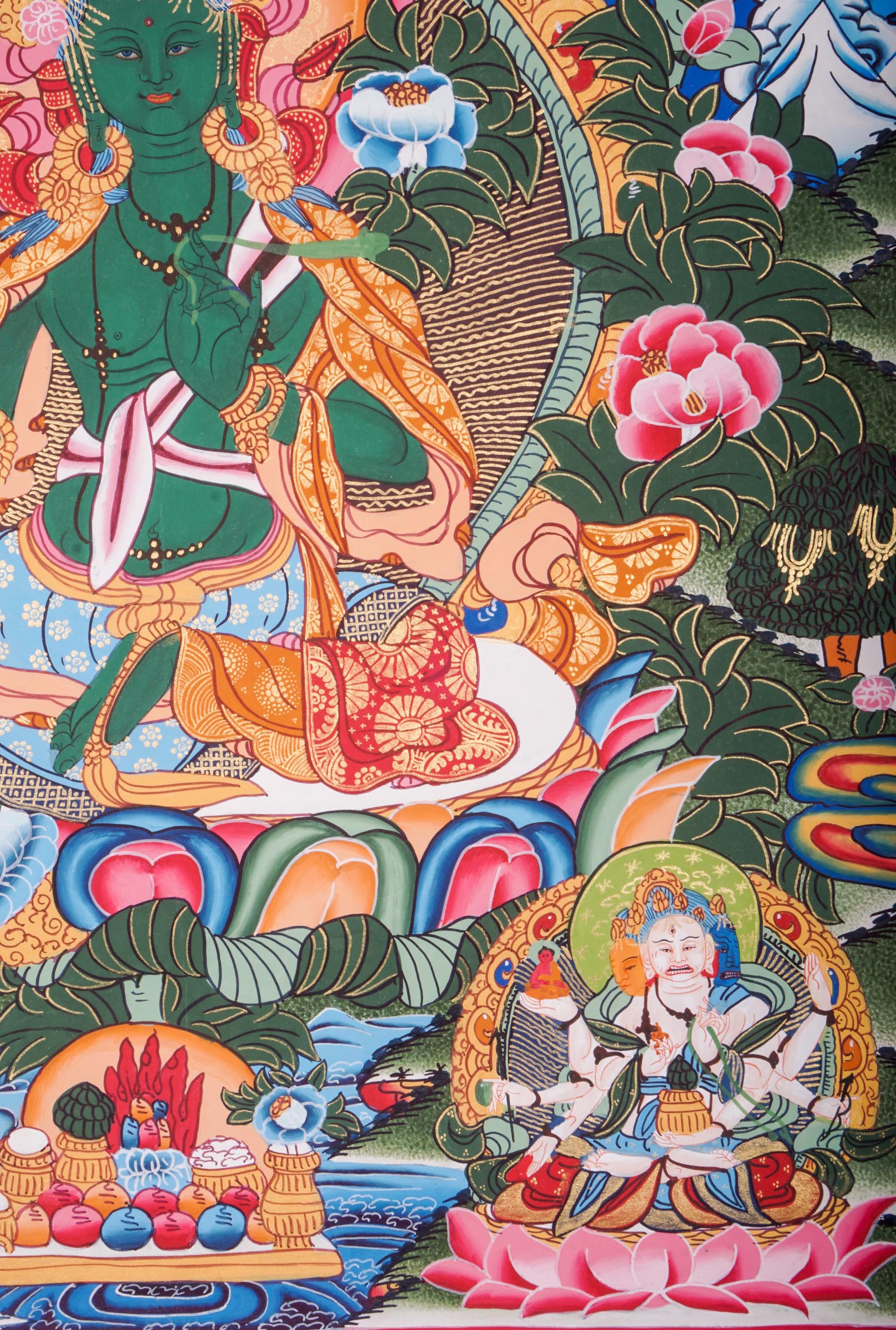 This genuine Tibetan Green Tara Thangka showcases the goddess of compassion and protection, hand-painted with natural pigments in traditional Himalayan style.