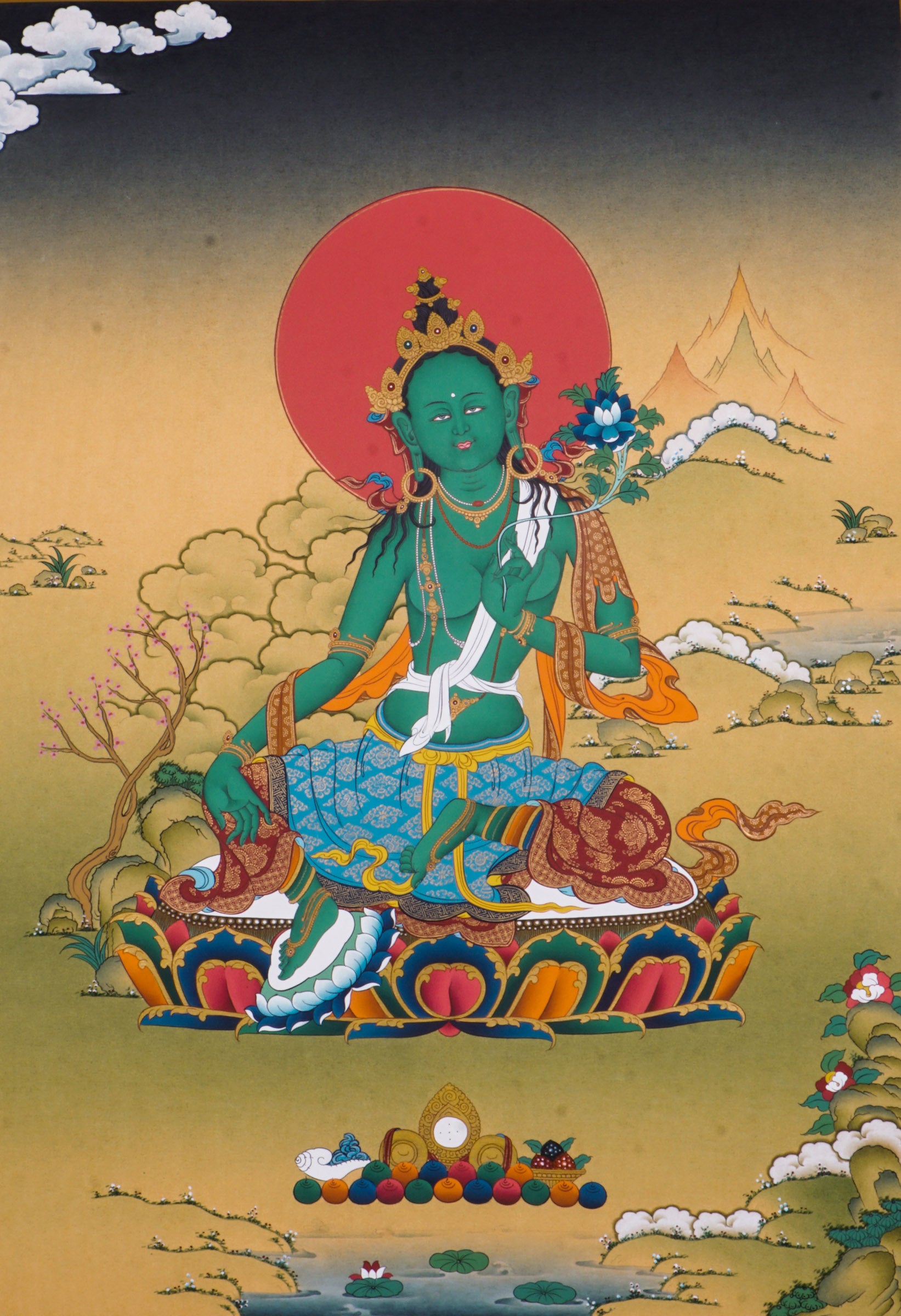 The Green Tara Thangka Painting features the compassionate Tibetan Buddhist goddess known for her swift protection and fearless energy. Hand-painted using traditional methods and natural pigments, this genuine Thangka radiates Green Tara’s benevolence and is a powerful symbol of courage, healing, and divine support.
