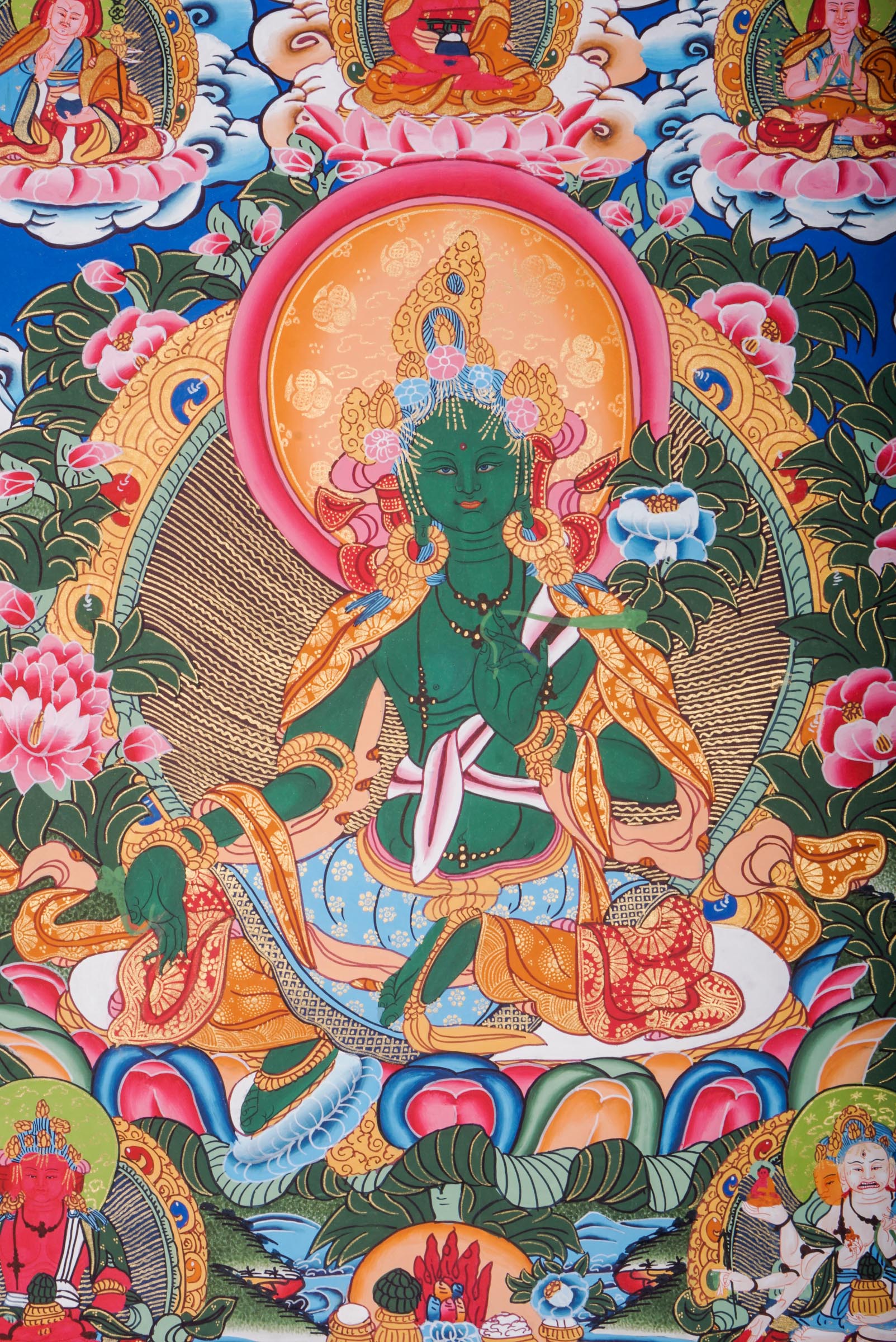 This genuine Tibetan Green Tara Thangka showcases the goddess of compassion and protection, hand-painted with natural pigments in traditional Himalayan style.