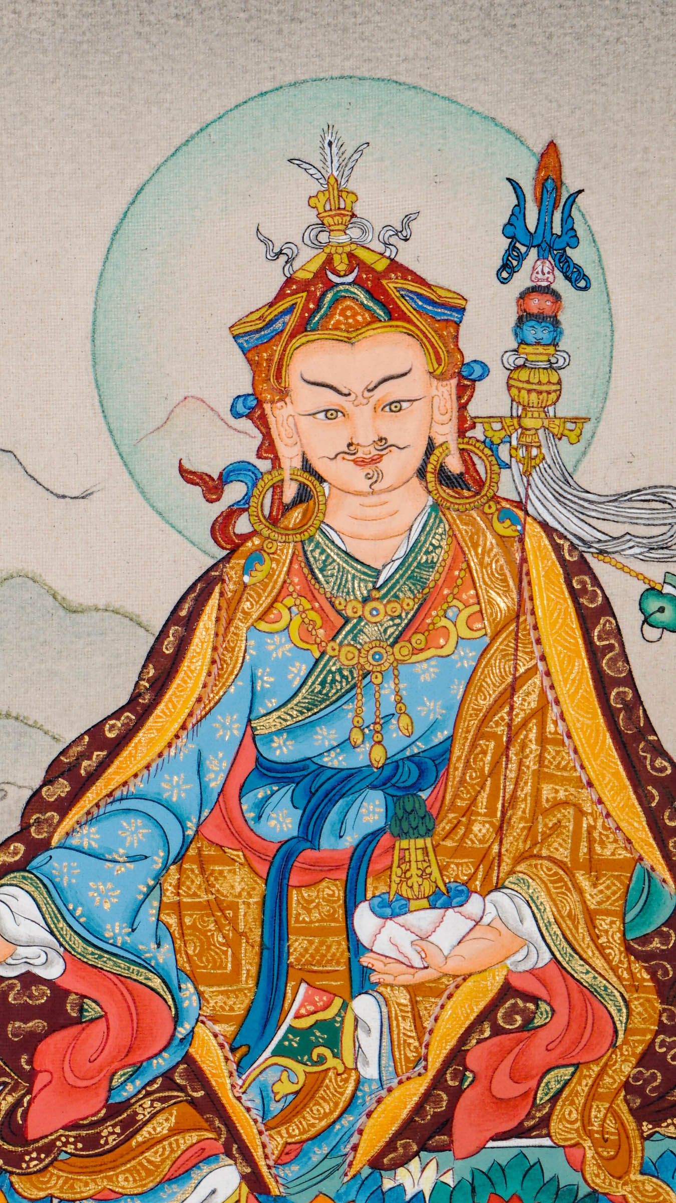 Padmasambhava seated on a lotus throne, holding a vajra and skull cup with khatvanga resting on his arm, surrounded by a serene landscape and radiant aura.