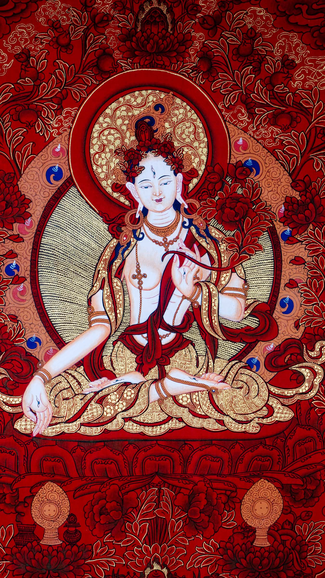 This White Tara Thangka features White Tara, a important figure in Tibetan Buddhism representing purity and calmness.