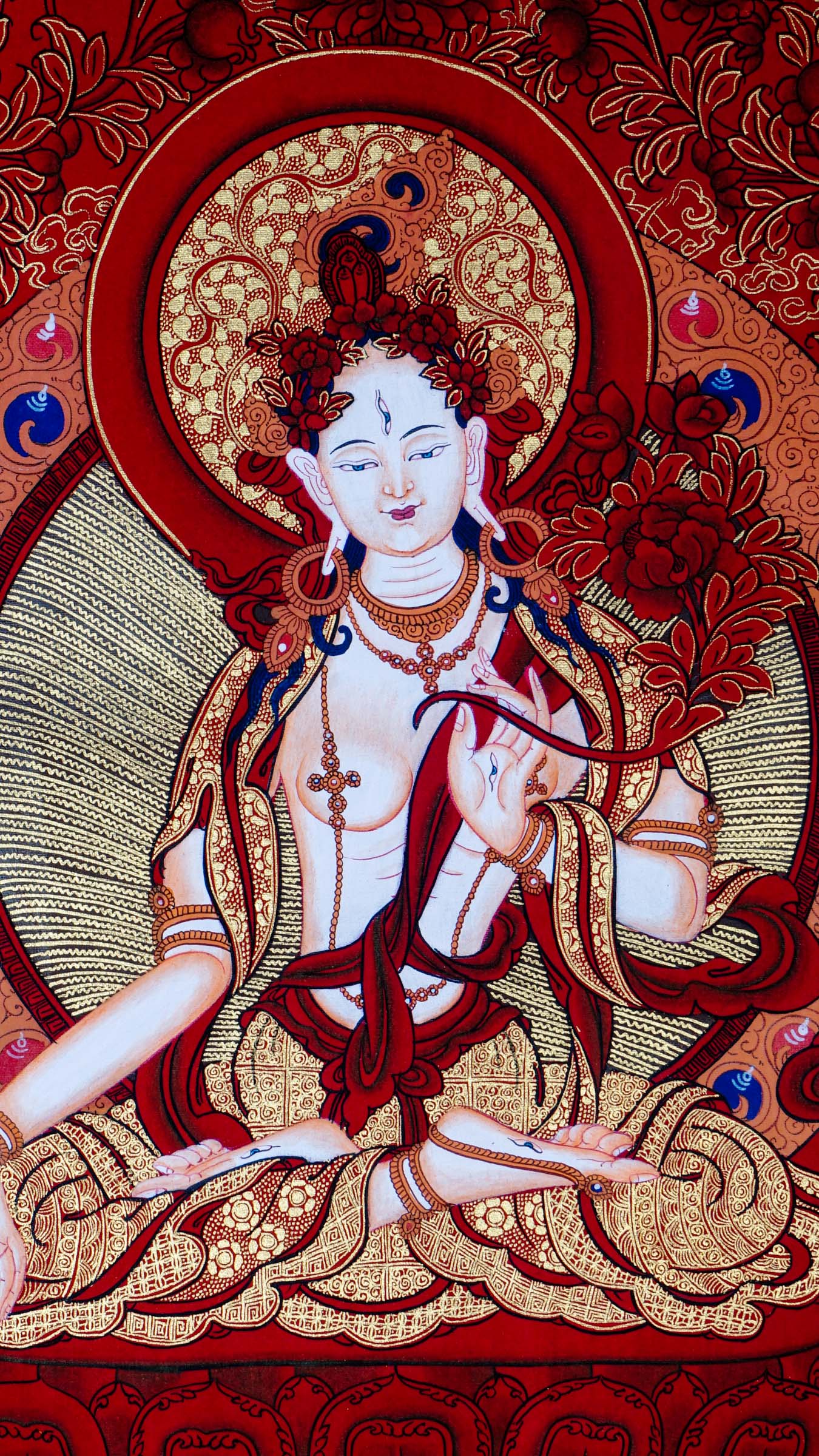 This White Tara Thangka features White Tara, a important figure in Tibetan Buddhism representing purity and calmness.