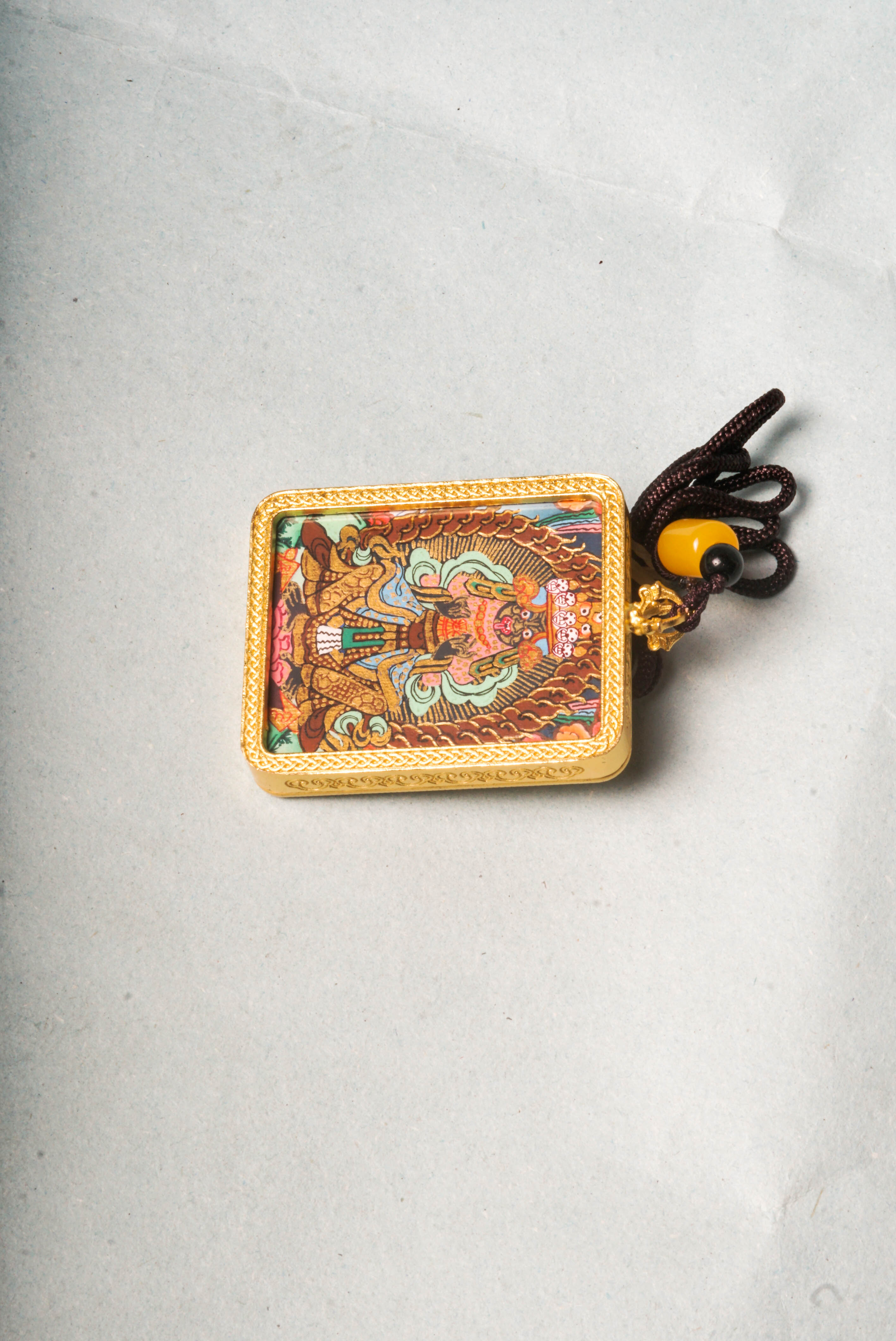 The Kali Ghau Thangka is a powerful depiction of the fierce goddess Kali, symbolizing the destruction of ego and protection on the spiritual path. Hand-painted with natural pigments, it serves as a portable source of strength, transformation, and divine feminine energy.