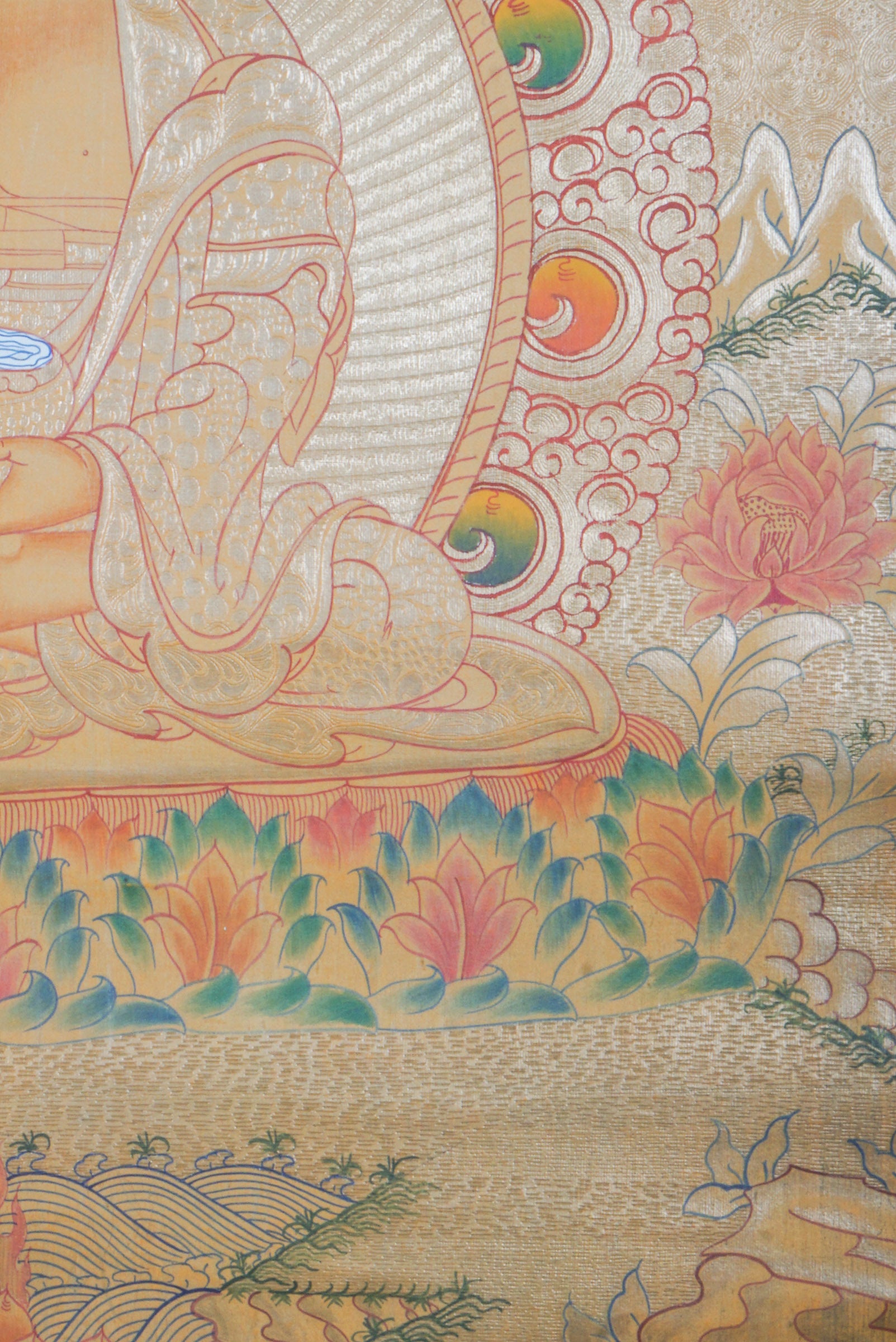 Amitabha Buddha on Gold- a depiction of a seated Buddha figure with decorative elements on a textured background