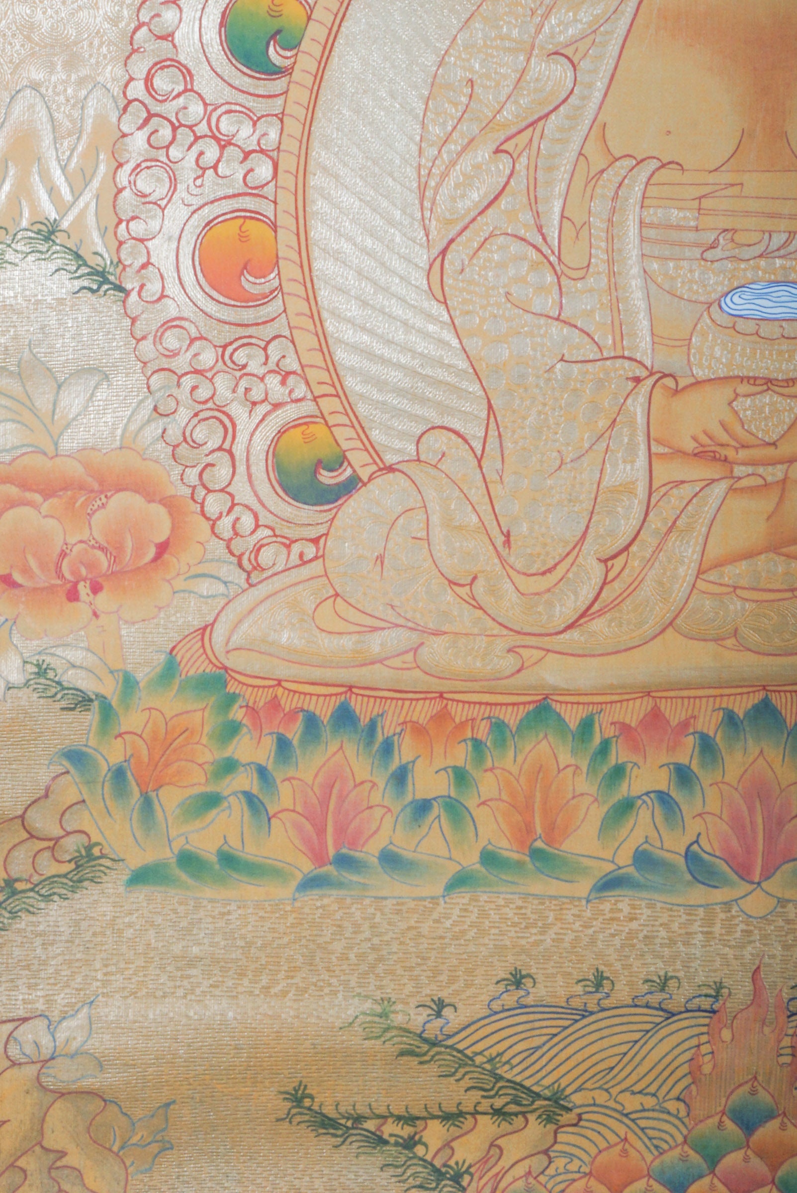 Amitabha Buddha on Gold- a depiction of a seated Buddha figure with decorative elements on a textured background