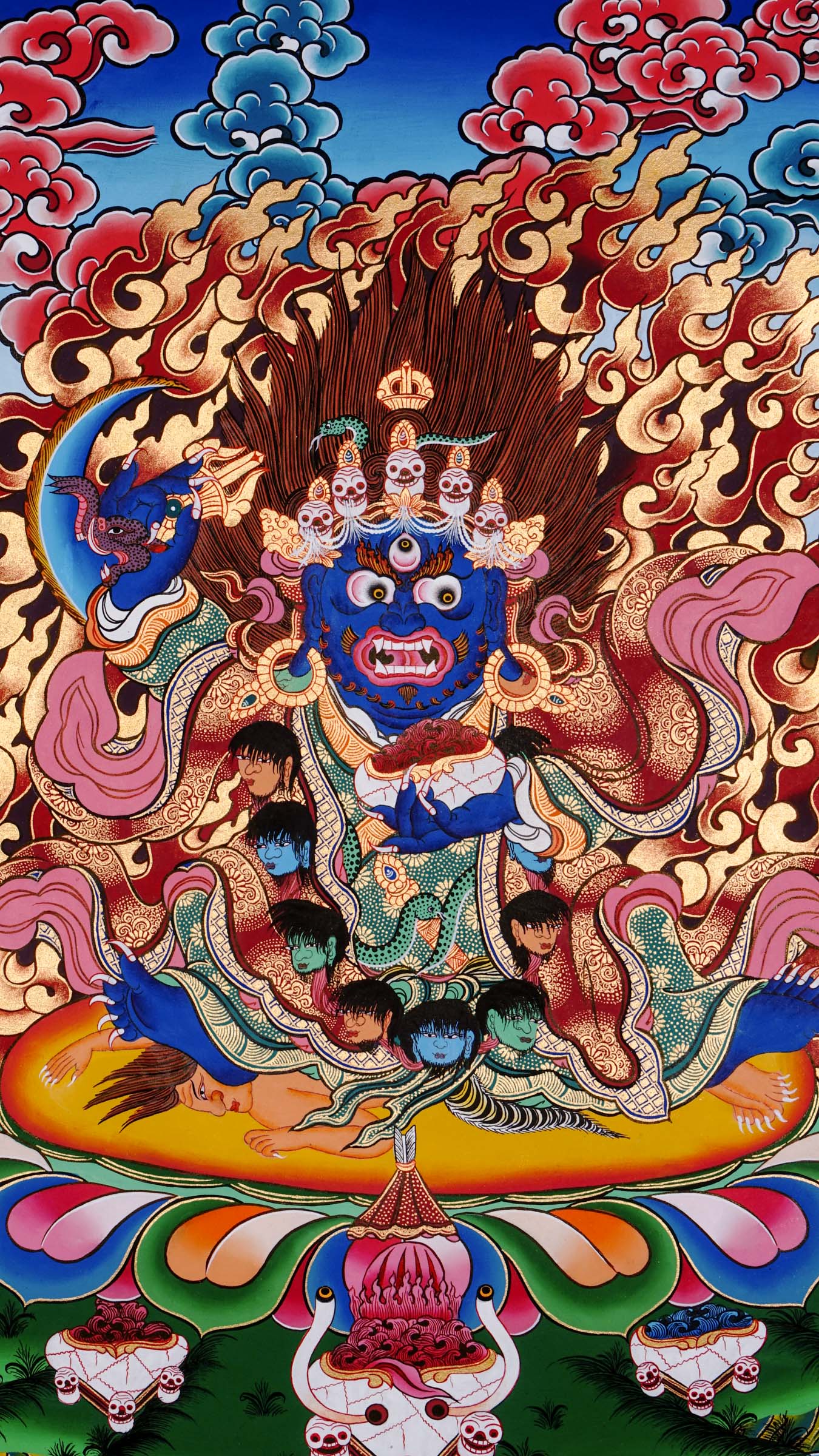 Hand-painted Mahākāla thangka from Kathmandu, Nepal depicting the wrathful protector deity with dark blue body, skull crown of five skulls, garland of severed heads, holding skull cup and curved knife, surrounded by red flames in traditional Tibetan Vajrayana style.
