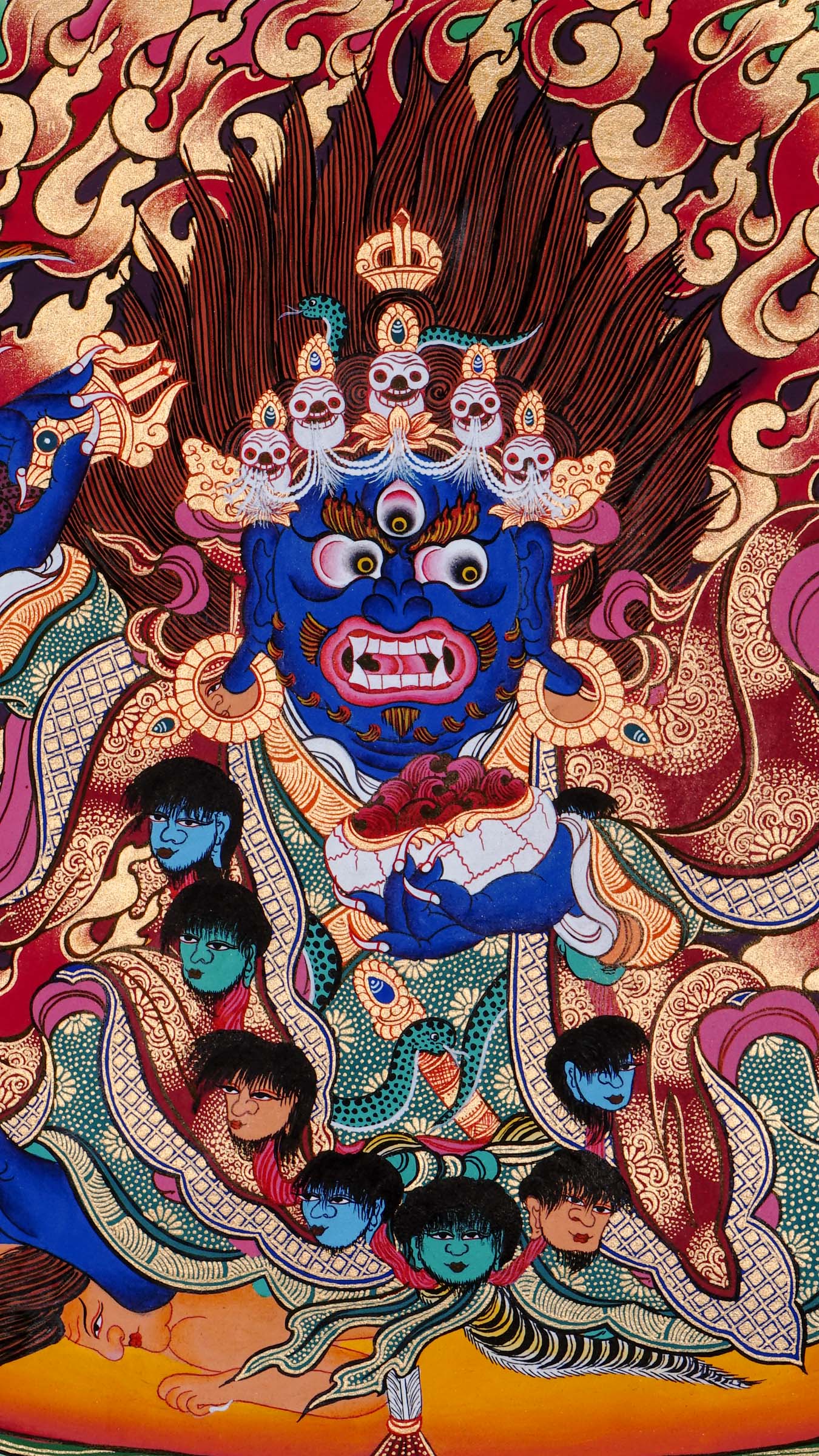 Tibetan Buddhist thangka of Mahakala with dark blue body, five-skull crown, garland of severed heads, holding skull cup and curved knife, surrounded by red flames, hand painted in Kathmandu, Nepal.