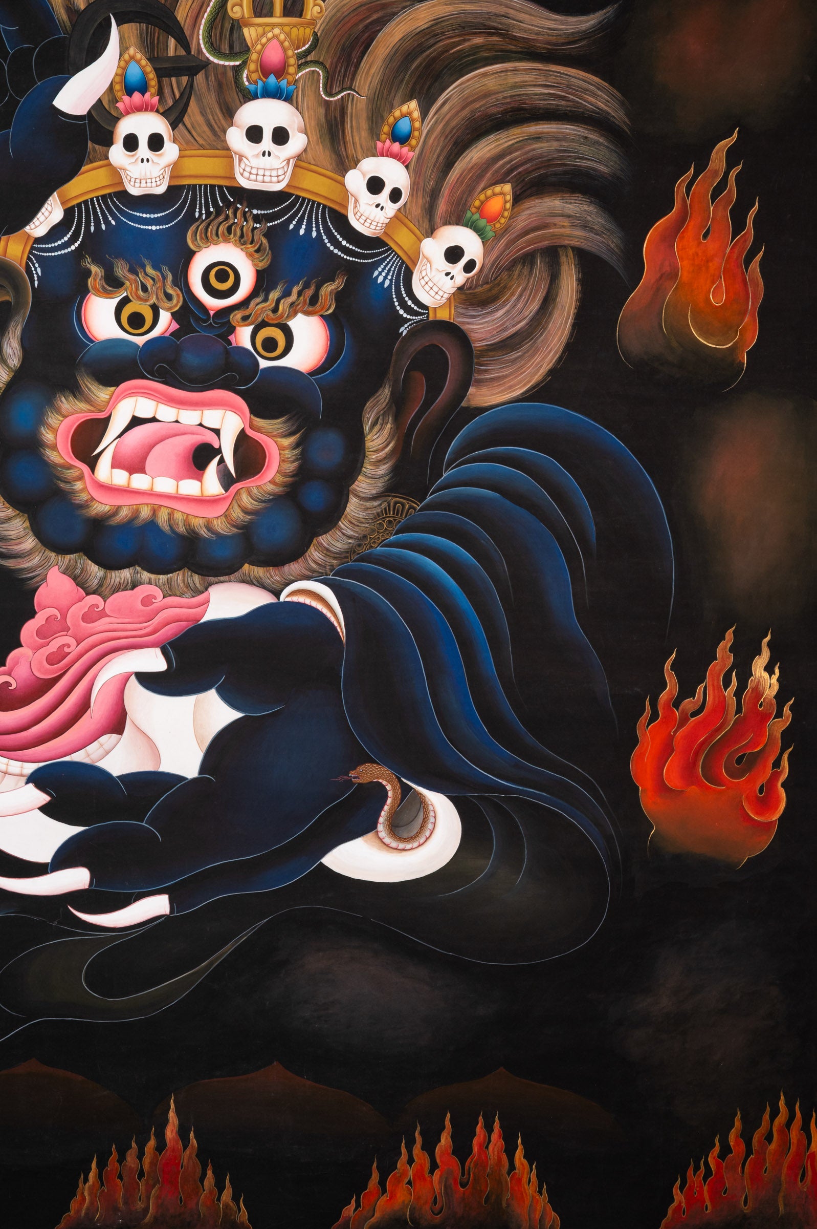 Short Kagyu Mahakala Thangka depicting the wrathful Dharma Protector Mahakala with raised curved chopper, skull crown, flaming hair, and blazing aura, embodying fierce compassion and protection in traditional hand-painted Tibetan Buddhist art.