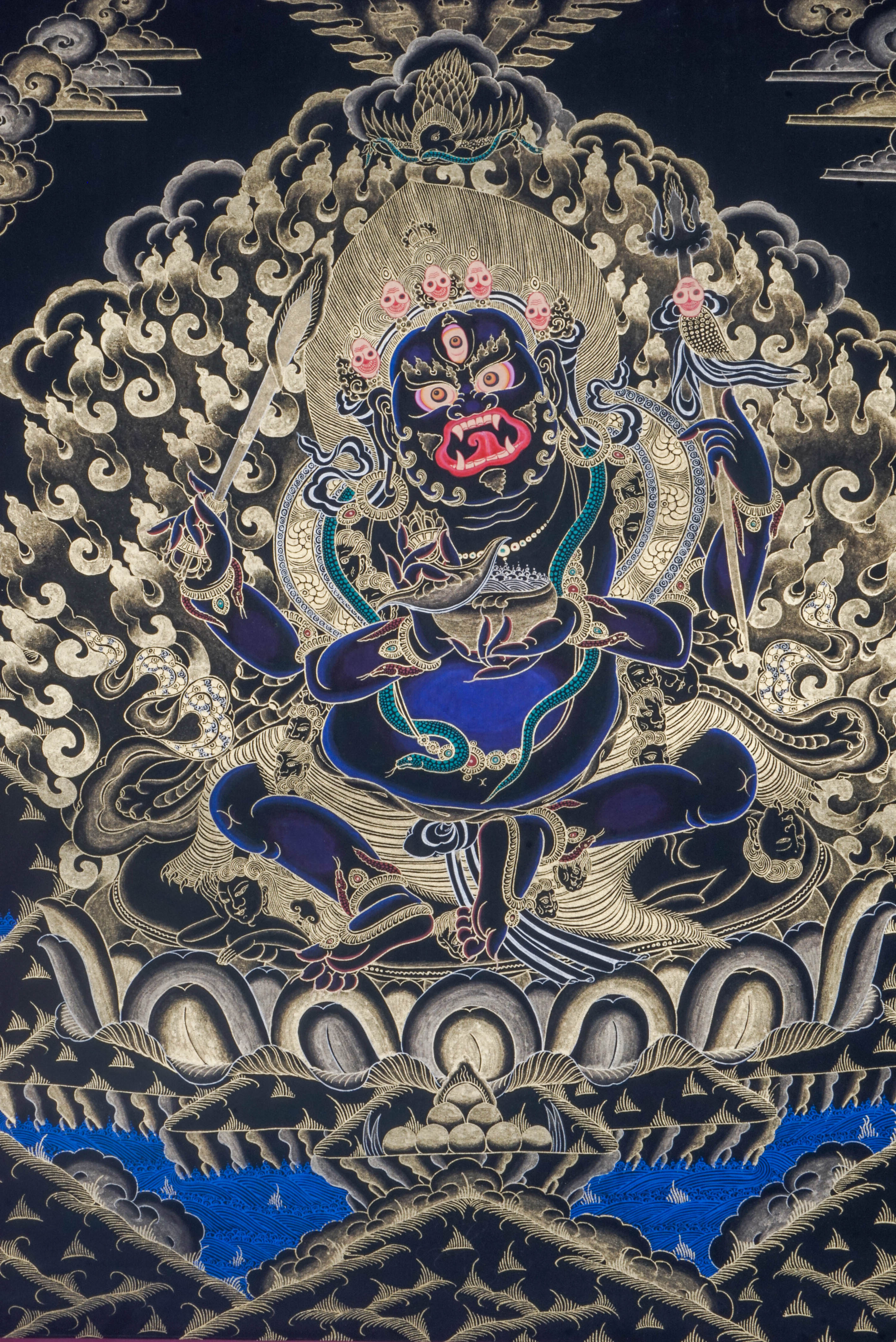 The 4 hand Mahakala Thangka Painting captures the fierce protector of Tibetan Buddhism, symbolizing strength, transformation, and the removal of obstacles. Hand-painted with natural pigments and gold accents, this powerful artwork brings protection, focus, and deep spiritual energy to any sacred space.