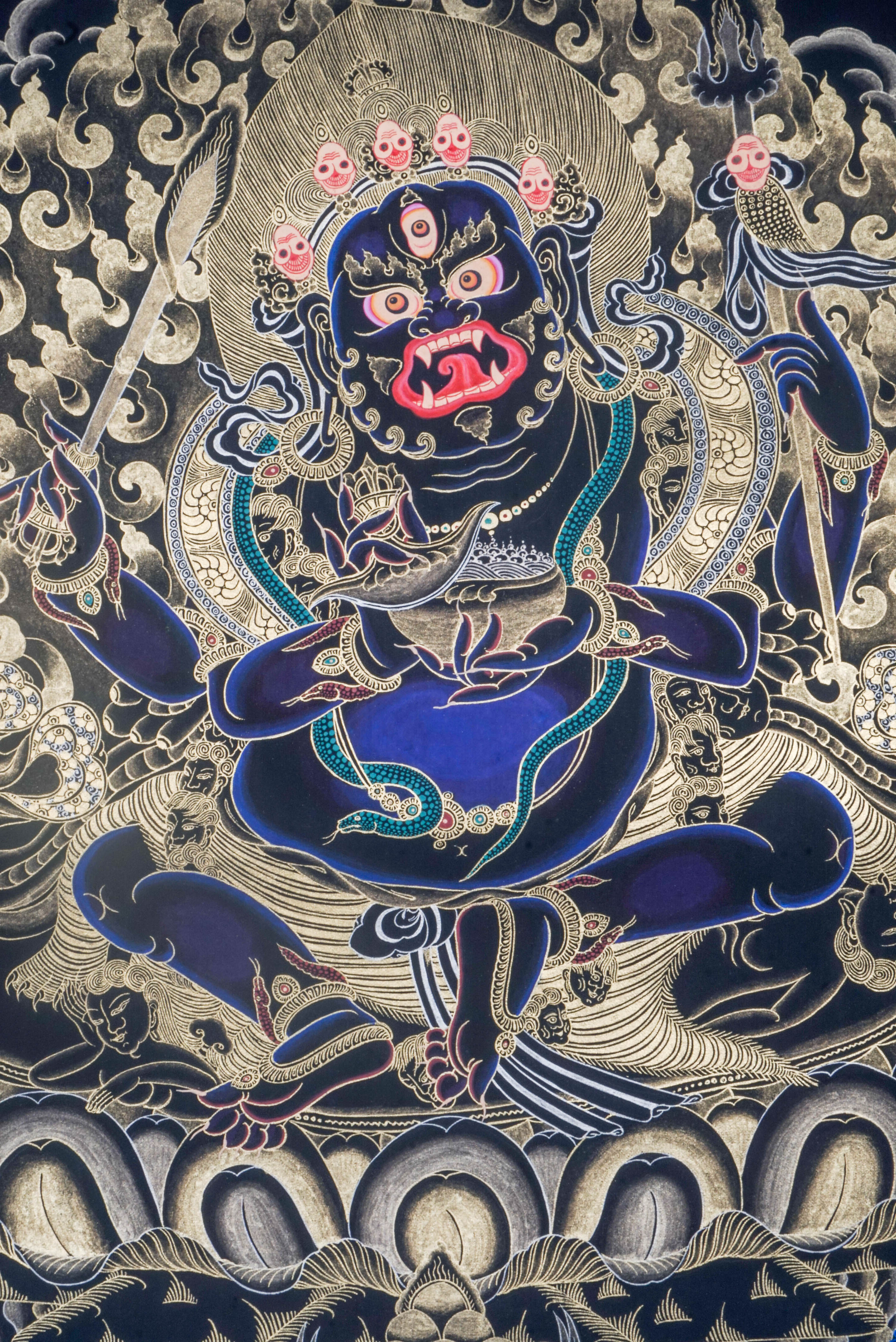 The Mahakala Thangka Painting captures the fierce protector of Tibetan Buddhism, symbolizing strength, transformation, and the removal of obstacles. Hand-painted with natural pigments and gold accents, this powerful artwork brings protection, focus, and deep spiritual energy to any sacred space.