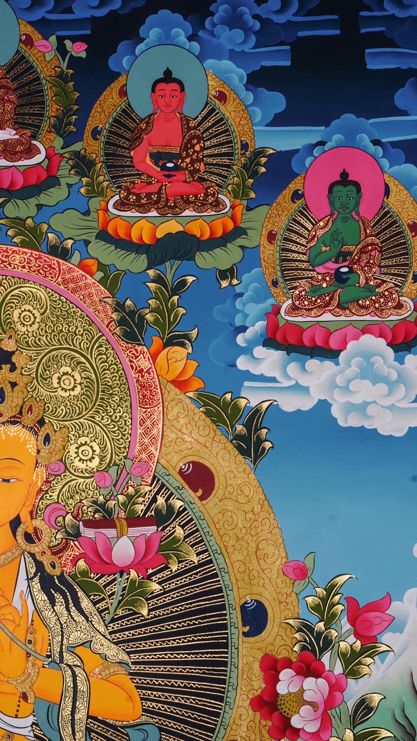 Hand painted Manjushri thangka from Kathmandu, Nepal, depicting the Bodhisattva of wisdom seated on a lotus throne holding a flaming sword and sutra on lotus, with Chenrezig, Mahakala, and Five Dhyani Buddhas, in traditional Tibetan Vajrayana style with 24k gold.