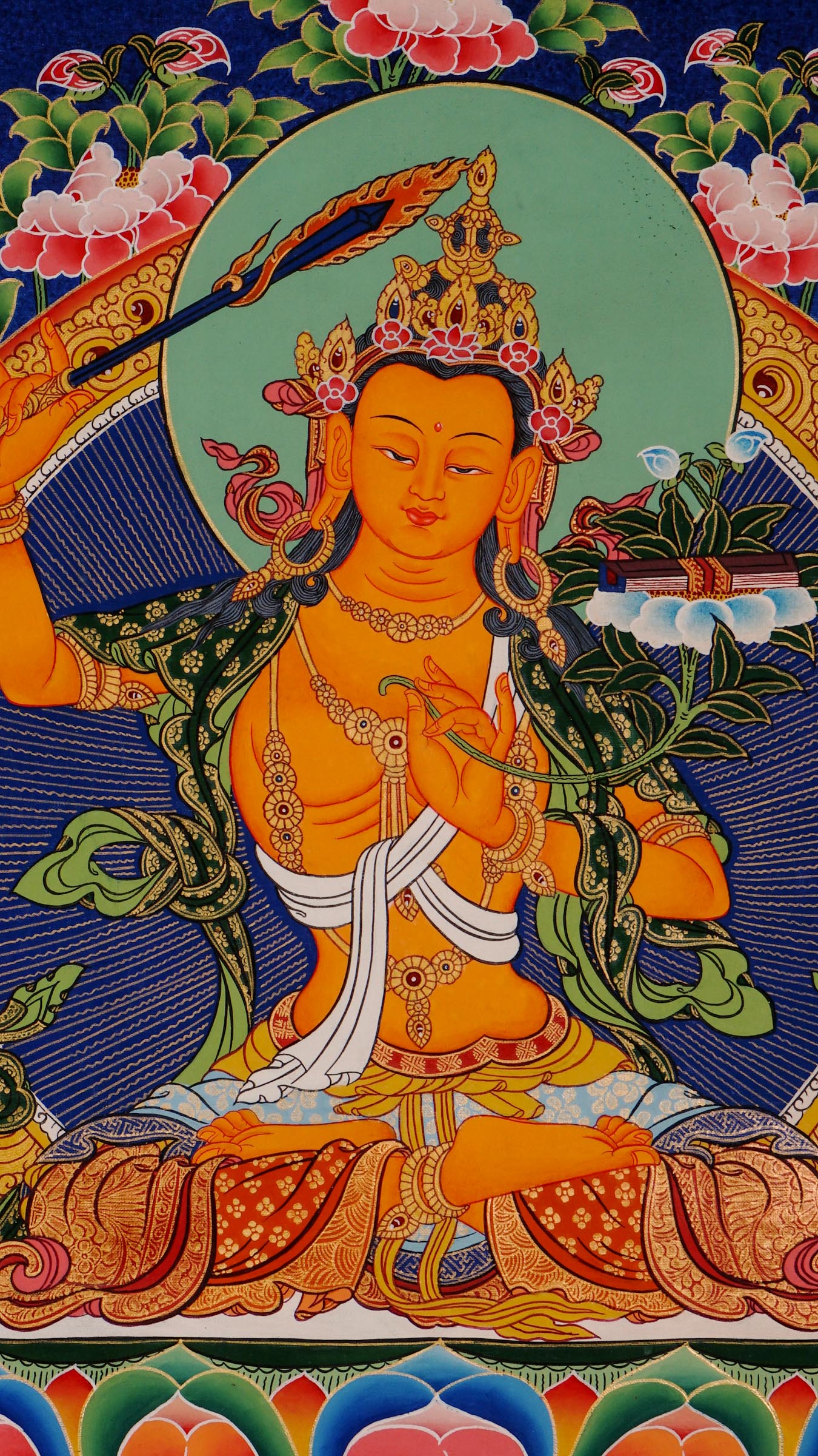 Traditional Manjushree Thangka from Nepal, hand-painted with 24K gold, showing the Bodhisattva of Wisdom seated on a lotus throne with floral motifs in the background.
