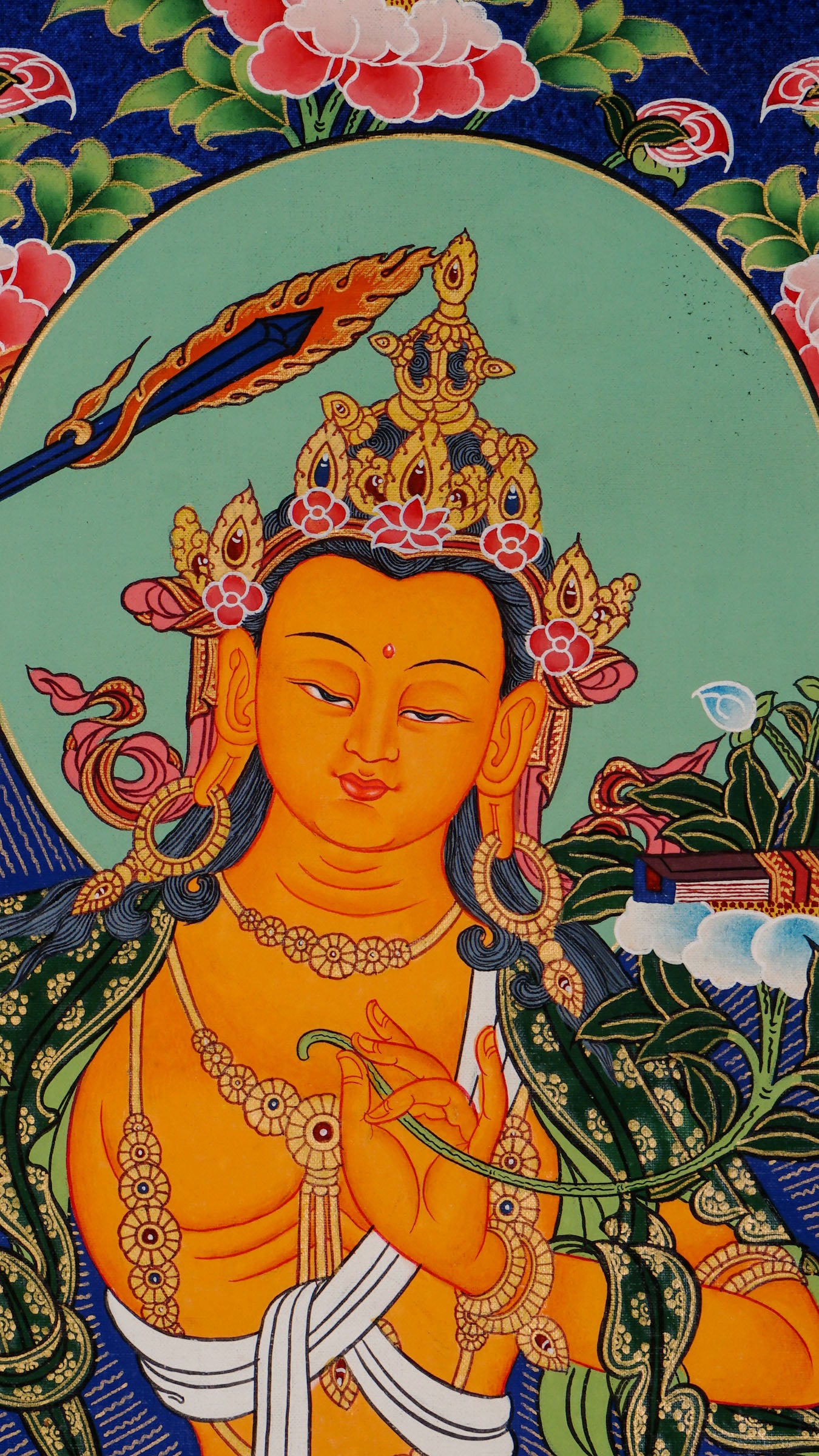 Traditional Manjushree Thangka from Nepal, hand-painted with 24K gold, showing the Bodhisattva of Wisdom seated on a lotus throne with floral motifs in the background.
