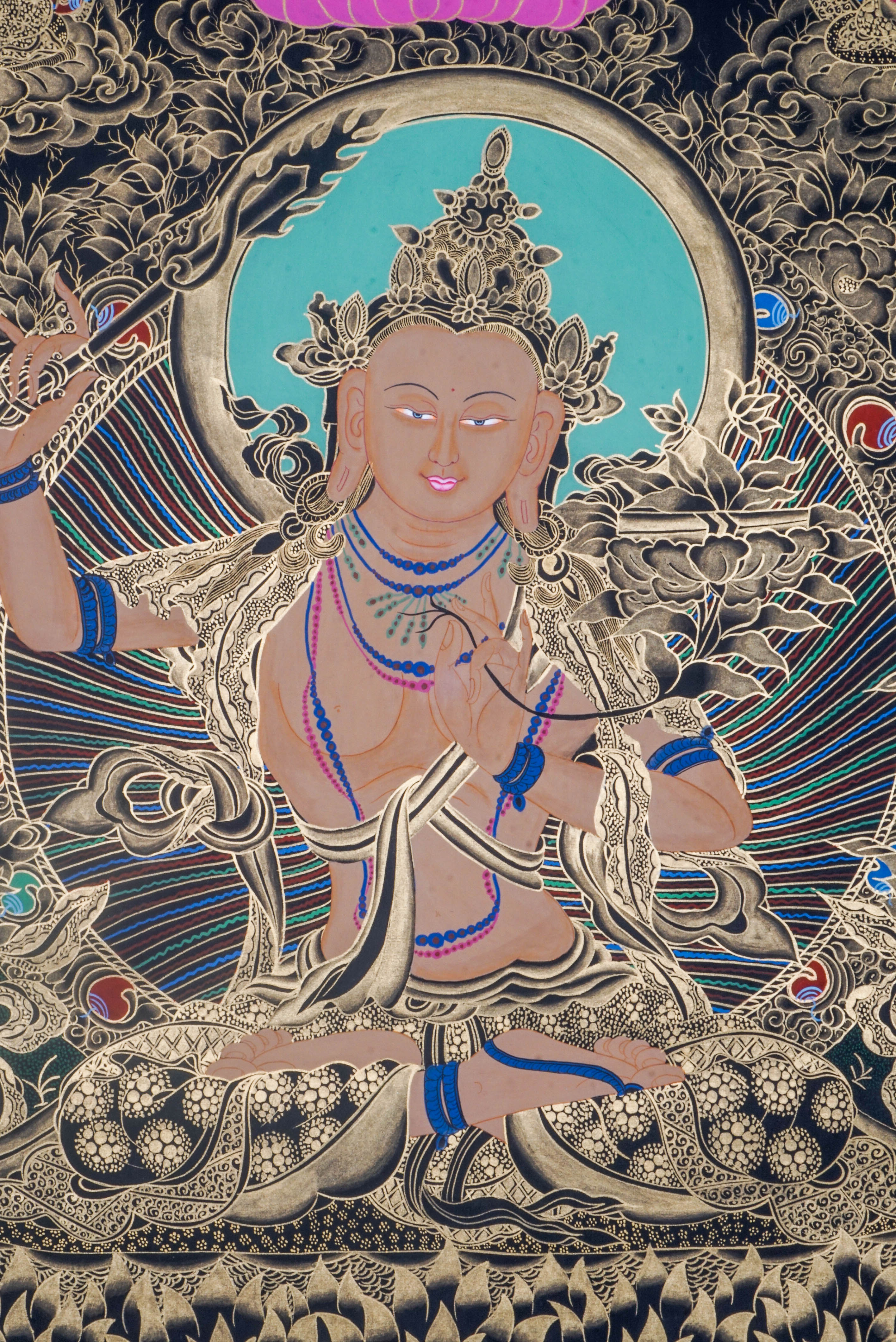 Manjushri Thangka depicts the Bodhisattva of Wisdom, holding a sword to cut ignorance and a scripture symbolizing Dharma knowledge. Hand-painted by skilled Tibetan artists using natural pigments, this sacred artwork inspires clarity, insight, and spiritual growth.