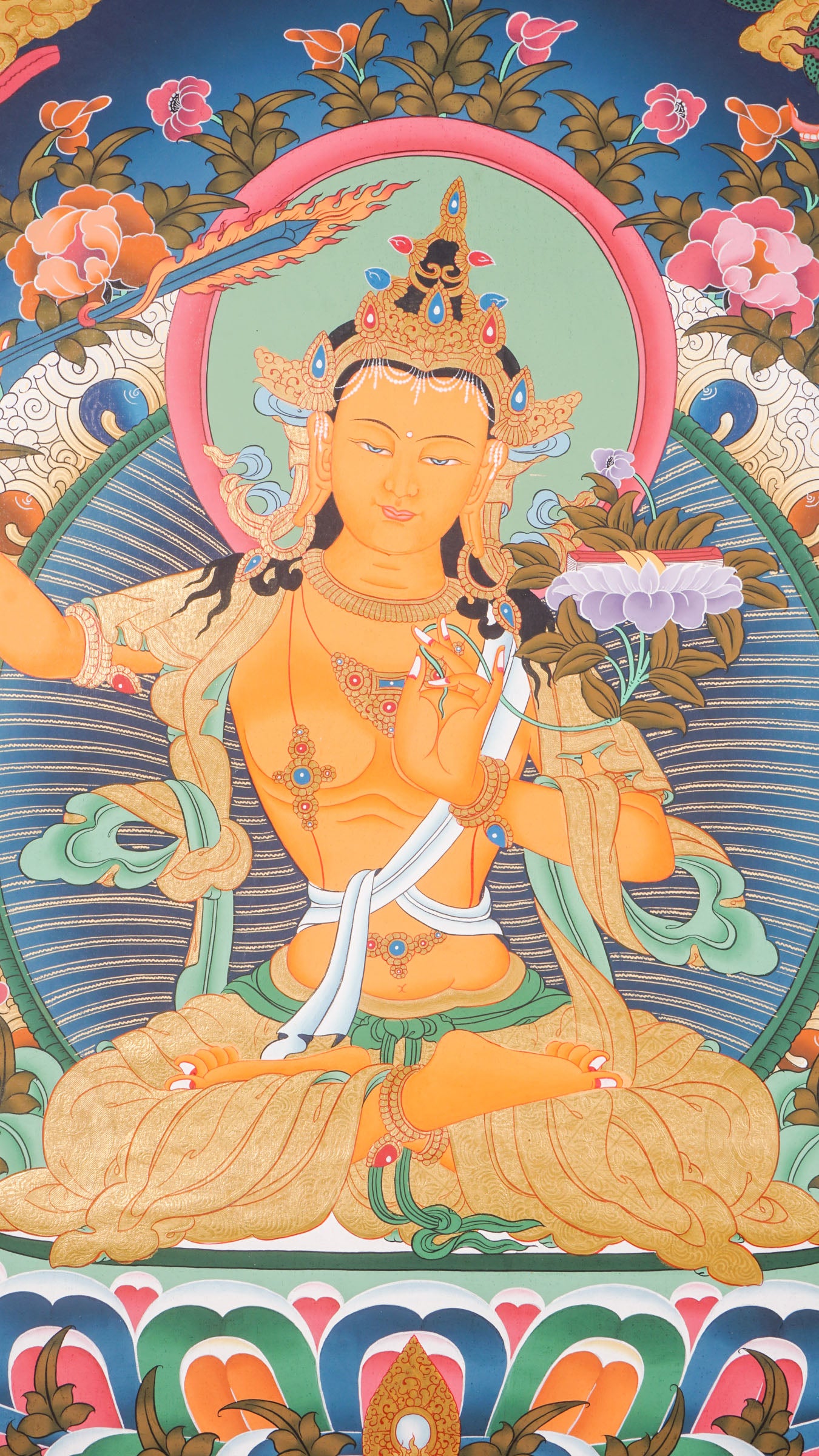 The Manjushree Thangka depicting the Bodhisattva of Wisdom seated on a lotus, holding a sword and a scripture.