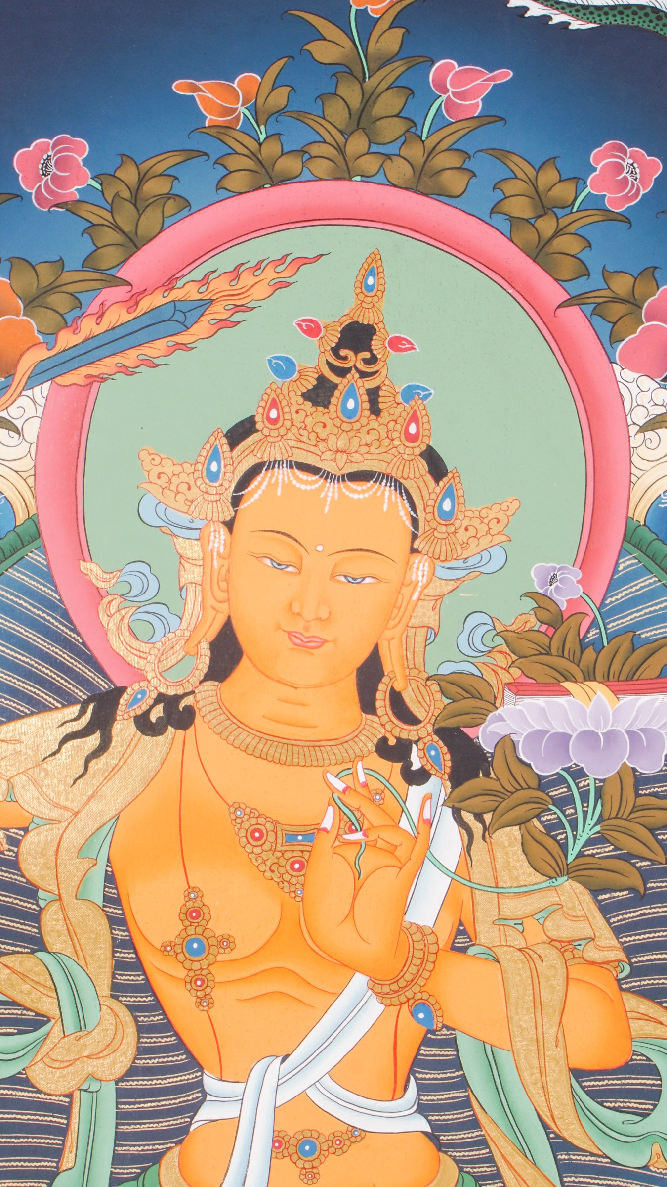 The Manjushree Thangka depicting the Bodhisattva of Wisdom seated on a lotus, holding a sword and a scripture.