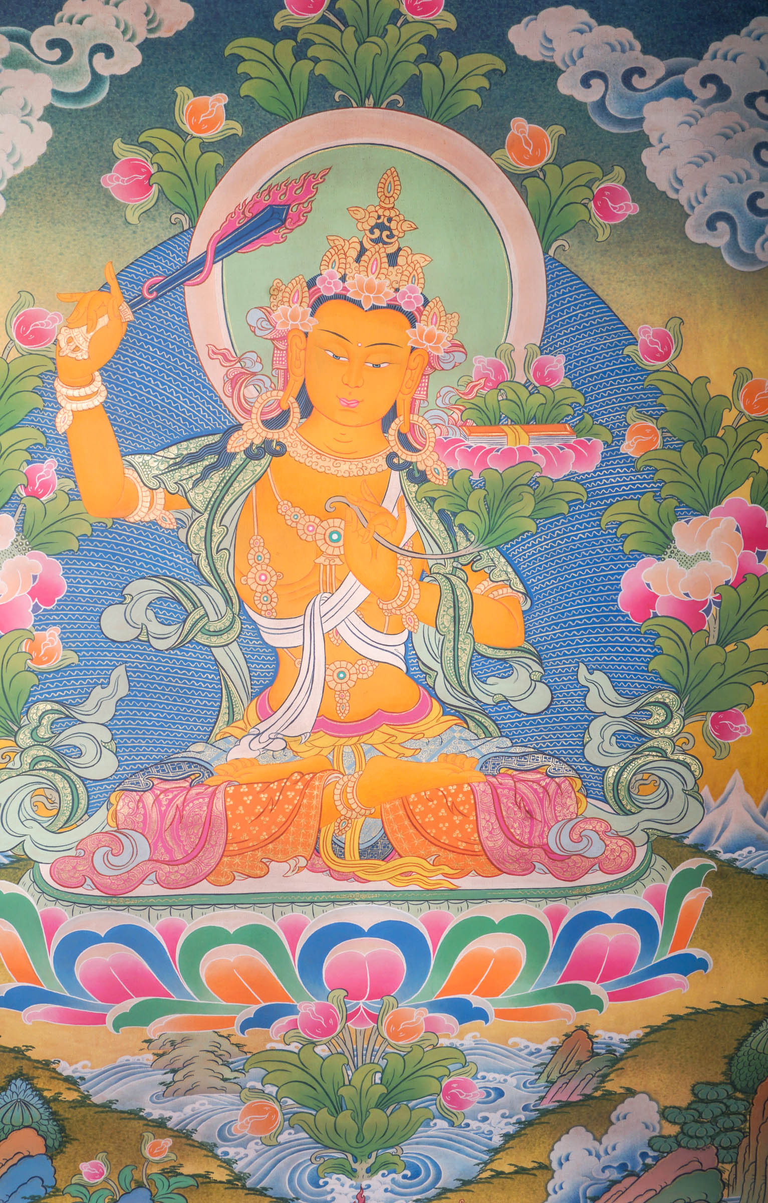 This genuine Tibetan Thangka of Manjushri features the Bodhisattva of wisdom holding a sword and scripture, symbolizing the cutting of ignorance and mastery of Buddhist teachings. Hand-painted with natural mineral pigments, this Buddhist artwork embodies clarity, insight, and spiritual guidance.