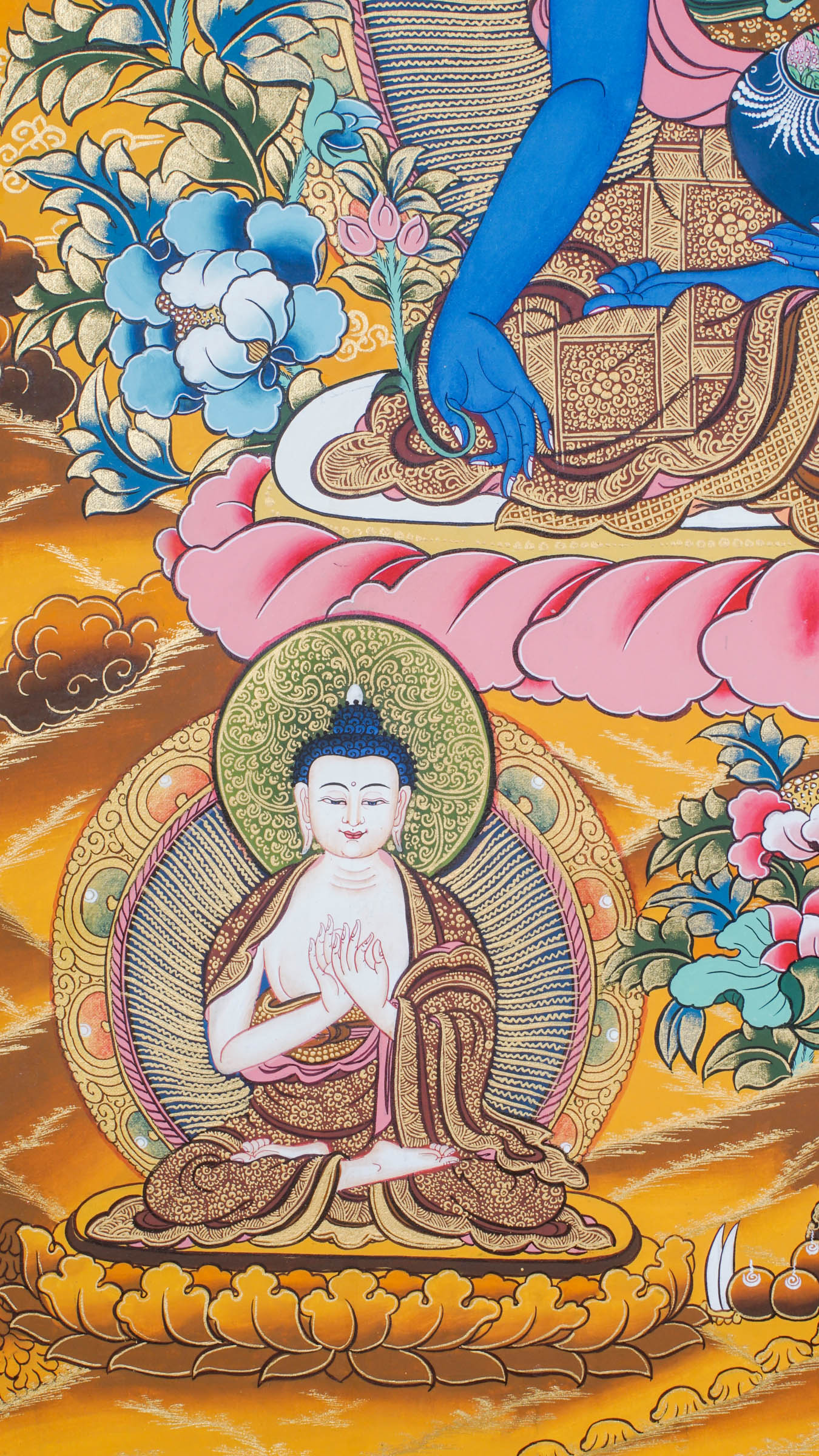 A sacred hand-painted thangka art of Medicine Buddha peacefully seated in a lotus throne symbolizing purity and healing.