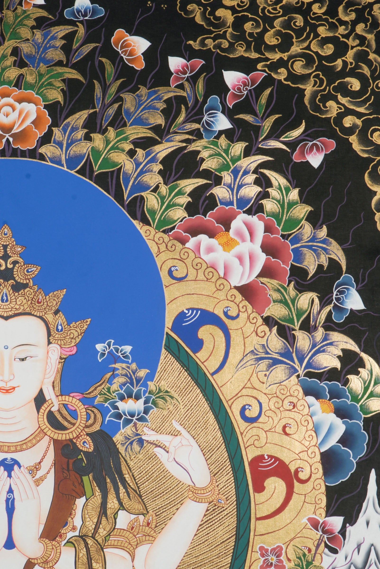 Hand-painted Thangka art portraying Chengresi, Avalokiteshvara in her serene form seated in a Lotus throne, created with 24k gold and natural pigments.