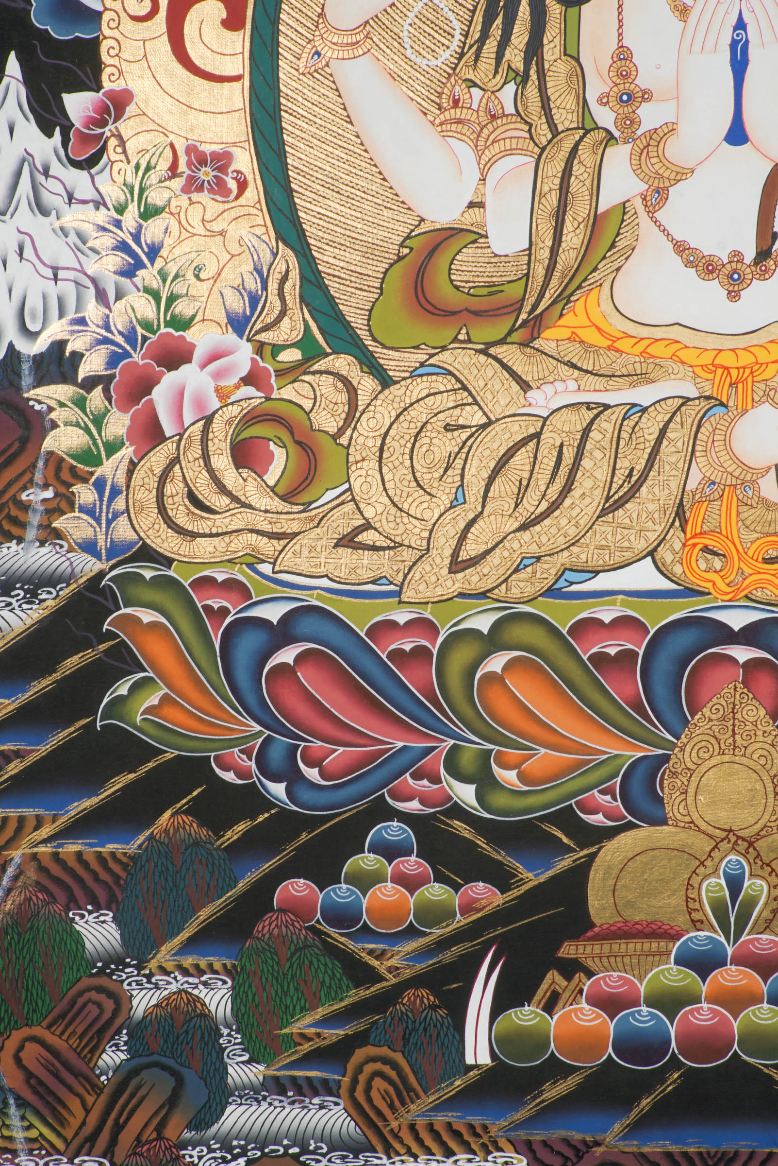 Hand-painted Thangka art portraying Chengresi, Avalokiteshvara in her serene form seated in a Lotus throne, created with 24k gold and natural pigments.