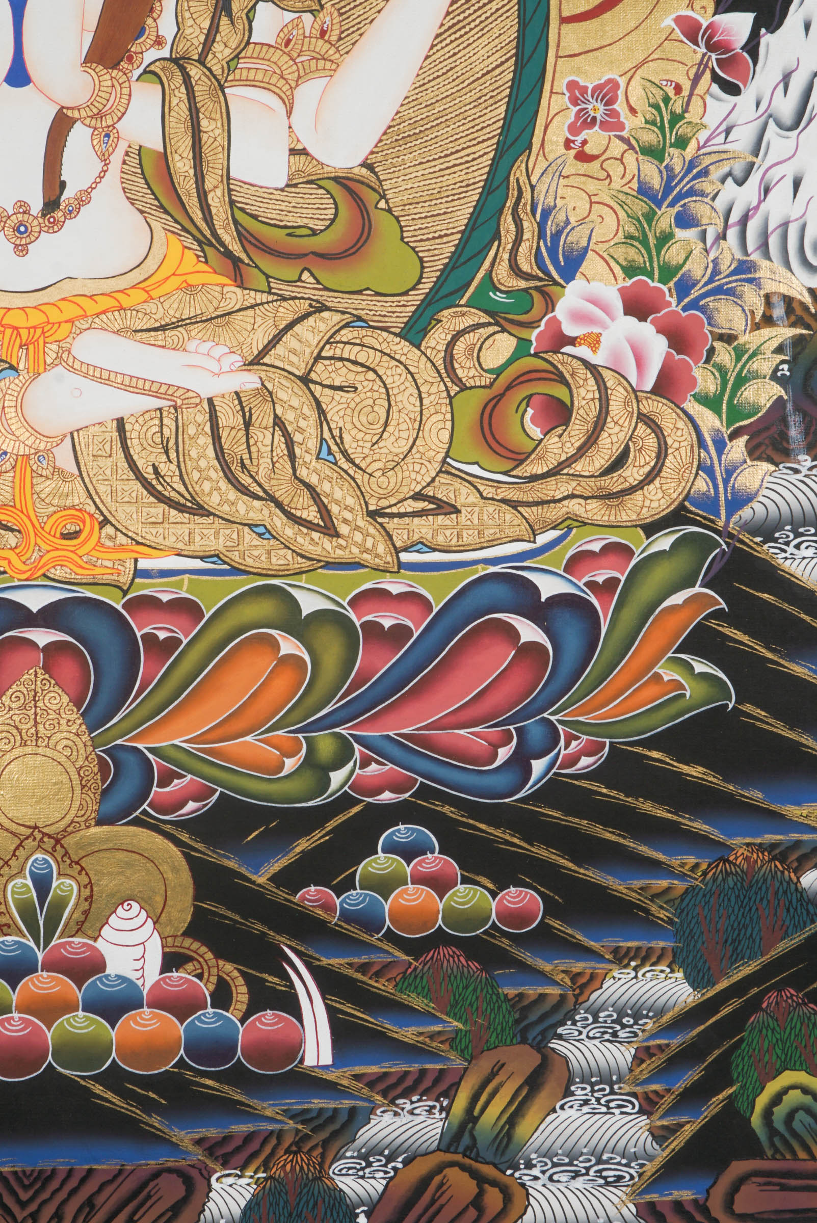 Hand-painted Thangka art portraying Chengresi, Avalokiteshvara in her serene form seated in a Lotus throne, created with 24k gold and natural pigments.