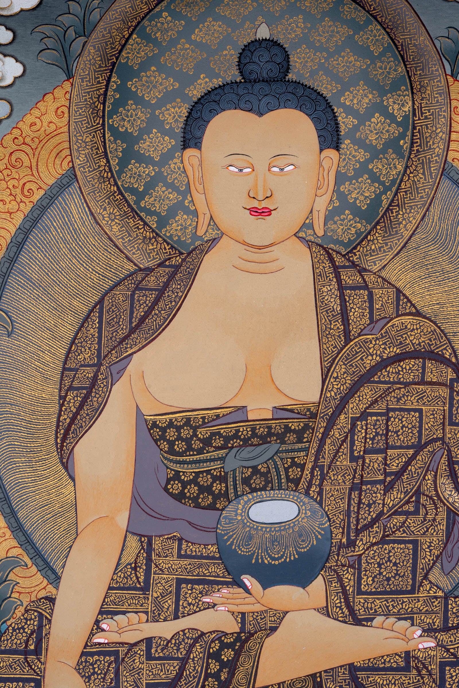 This genuine Tibetan Thangka of Shakyamuni Buddha is hand-painted with natural pigments, capturing his enlightened presence in serene detail. A perfect addition to any meditation or sacred space, it reflects the essence of Buddhist wisdom and compassion.