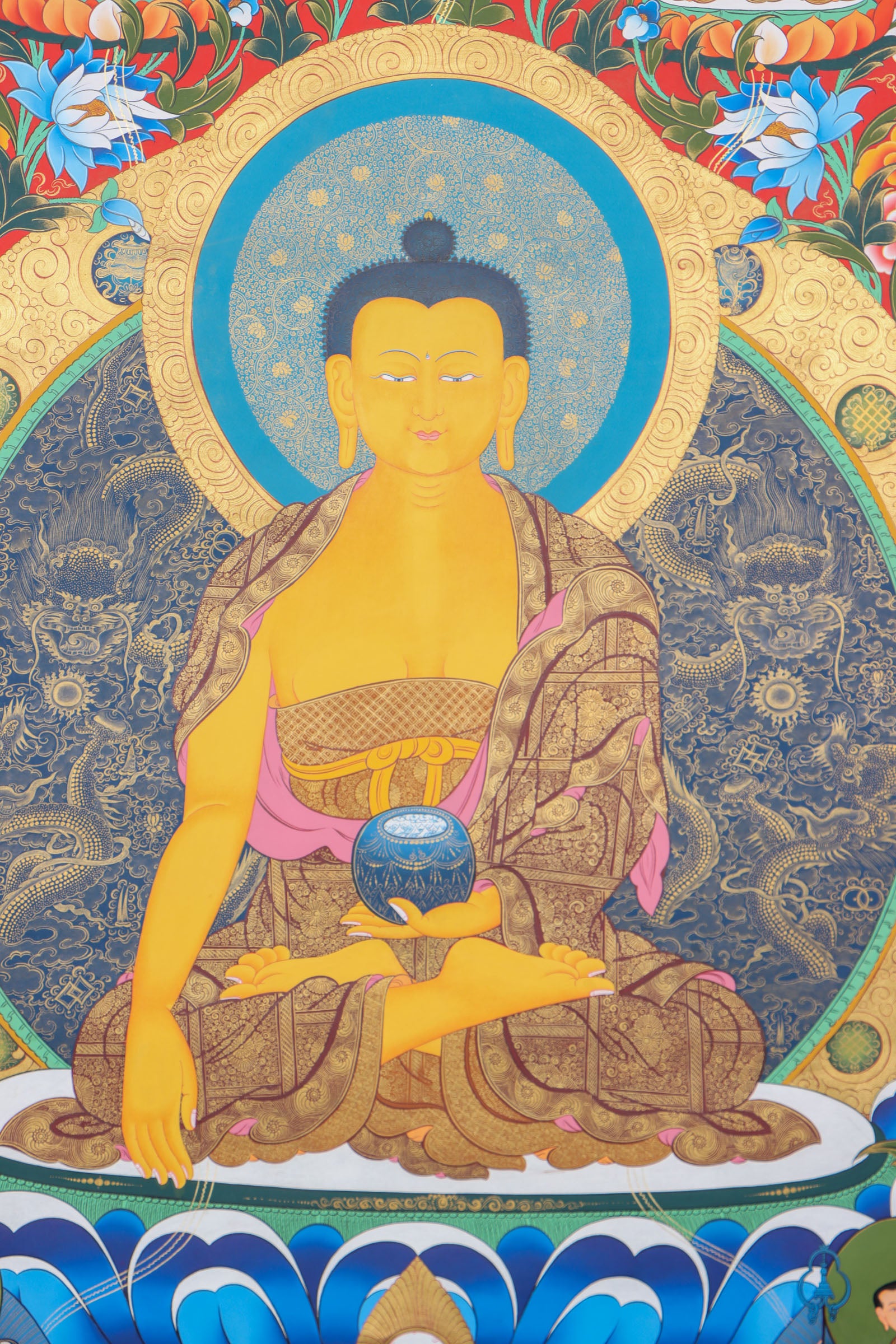This genuine Tibetan thangka of Shakyamuni Buddha is hand-painted using natural mineral pigments, capturing the essence of the historical Buddha in deep meditation. A sacred symbol in Buddhism, it brings serenity and spiritual depth to any space seeking mindful energy and enlightenment.