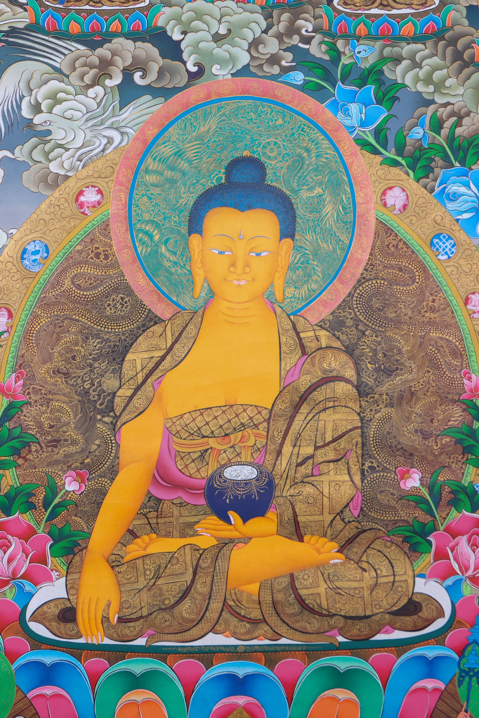This exquisite Shakyamuni Buddha Thangka, hand-painted on cotton canvas using natural mineral pigments, radiates the peaceful essence of the Enlightened One and reflects the deep spiritual artistry of Tibetan culture.
