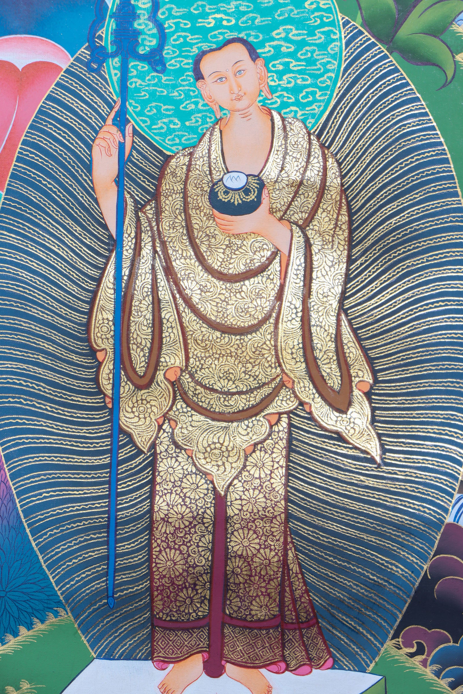 This genuine Tibetan thangka of Shakyamuni Buddha is handcrafted on cotton canvas using mineral pigments, capturing the enlightened essence of the historical Buddha with serene precision. A powerful symbol in Buddhism, it brings spiritual depth and sacred energy to any meditation or devotional space.