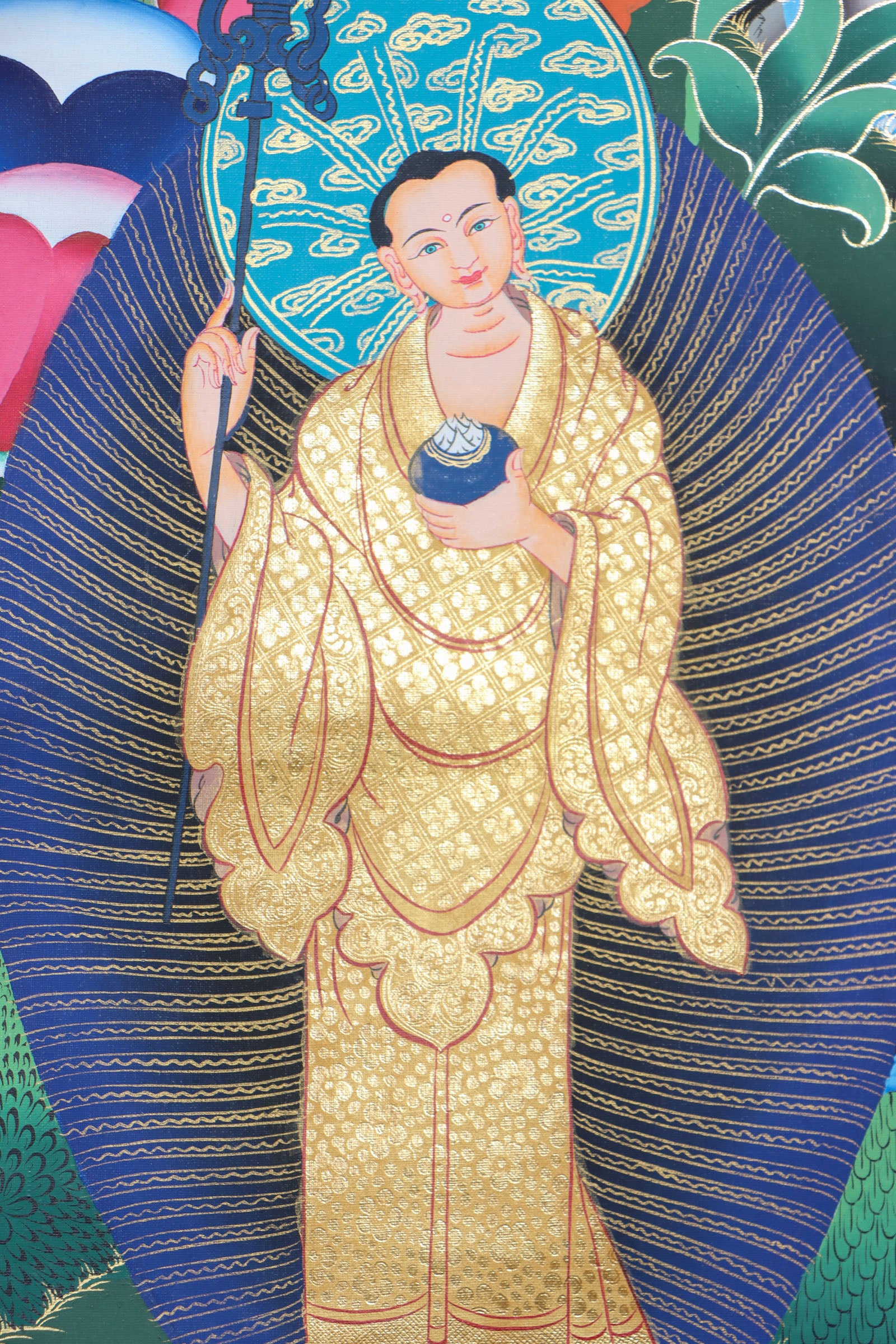 This genuine Tibetan thangka of Shakyamuni Buddha, hand-painted on durable cotton canvas with natural mineral pigments, beautifully captures his serene enlightened presence and profound teachings. Perfect for meditation spaces or sacred areas, this authentic Buddhist artwork radiates spiritual calm and showcases exceptional Tibetan craftsmanship.