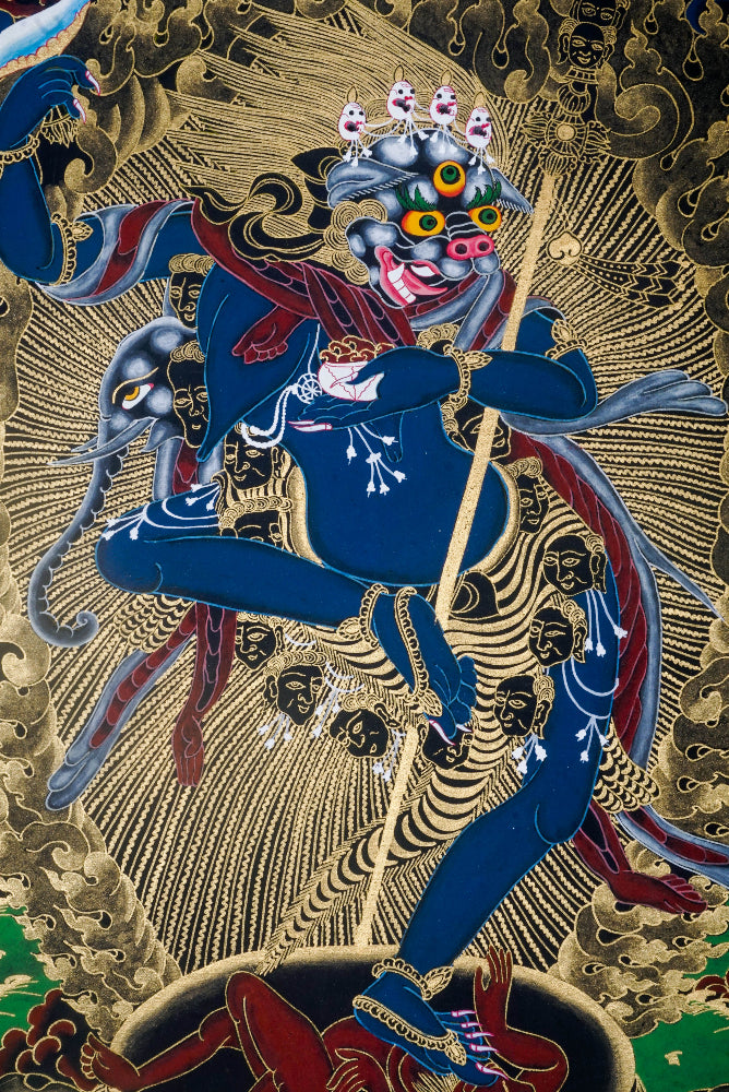 Simhamukha, the Lion-Faced Dakini, is a fierce protector in Tibetan Buddhism, symbolizing wisdom that cuts through ignorance and negativity. This hand-painted Thangka, crafted with natural pigments by skilled artisans, invites clarity, strength, and spiritual protection into your space.