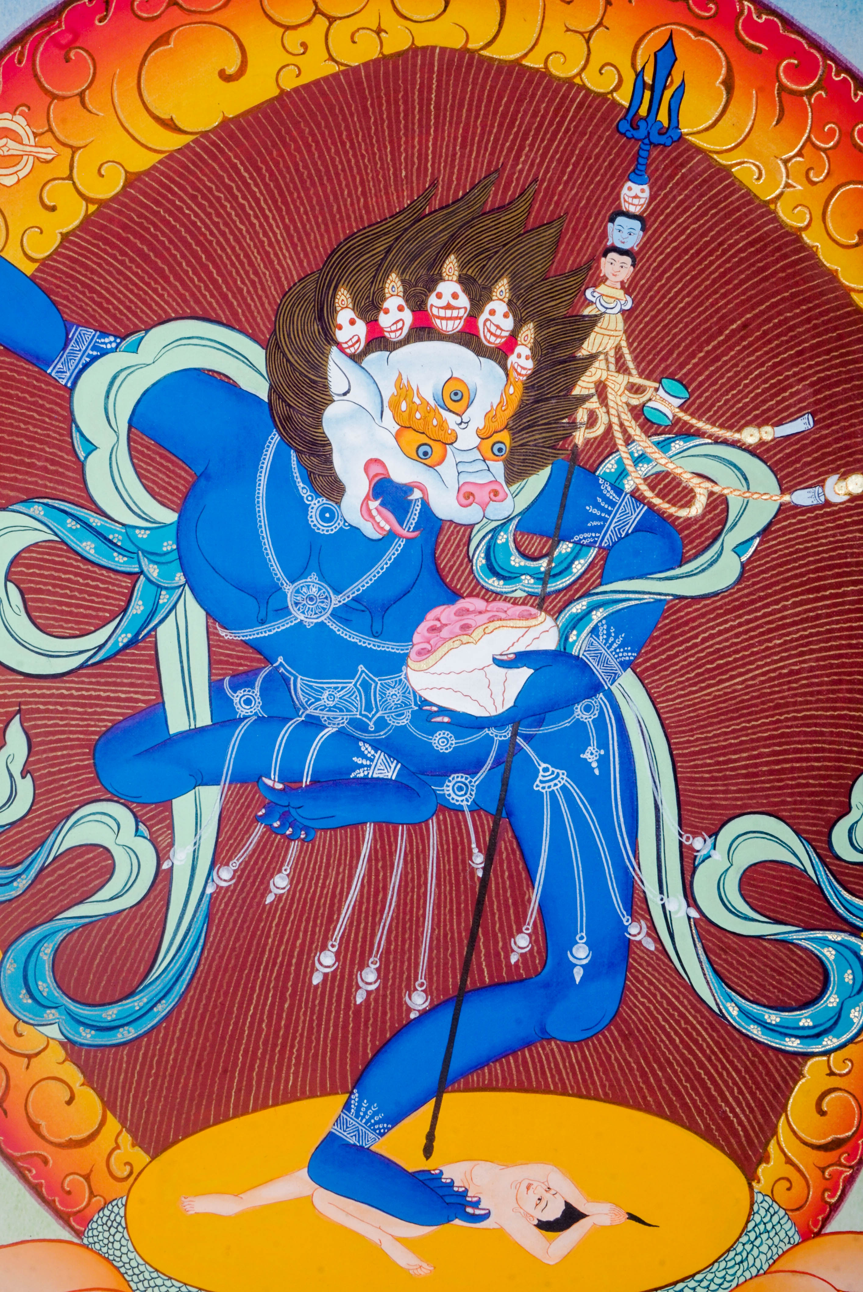 The Simhamukha Thangka shows the fierce Lion-Faced Dakini, a Tibetan Buddhist protector who removes negativity and ignorance. Hand-painted with natural pigments, it brings strength, clarity, and divine protection to any sacred space.