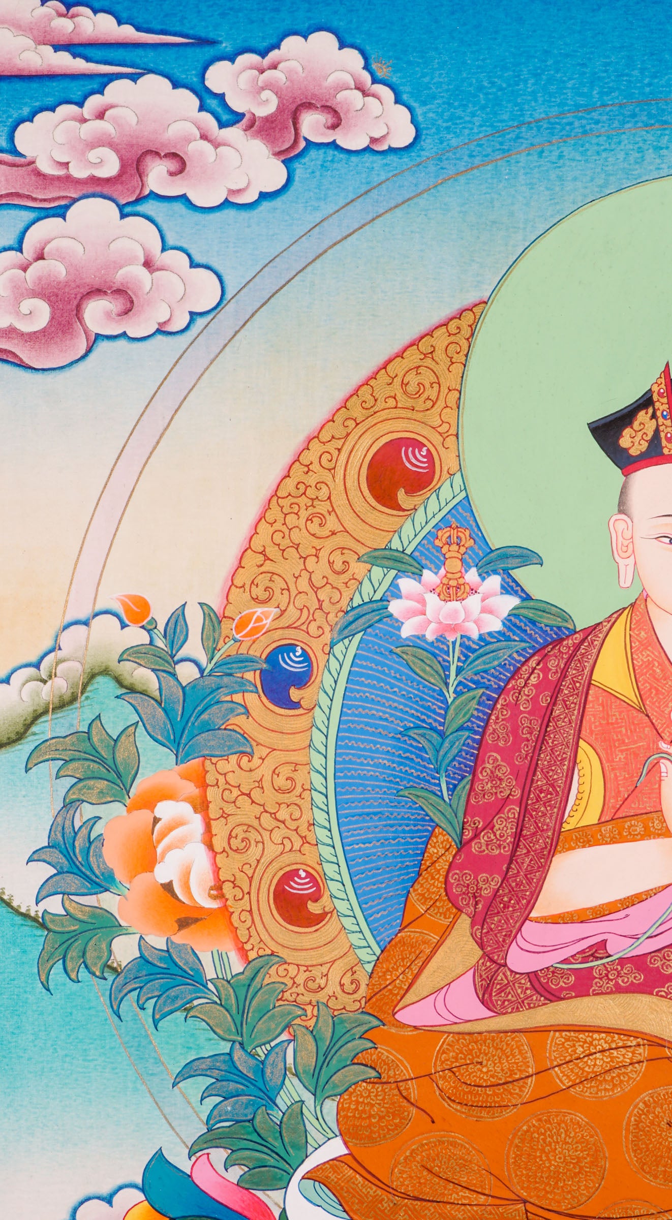 Traditional Tibetan thangka painting depicting the Karmapa Lama seated in meditation on a lotus throne, shown with a serene expression, monastic robes, a radiant halo, and surrounded by clouds, flowers, and a peaceful landscape.